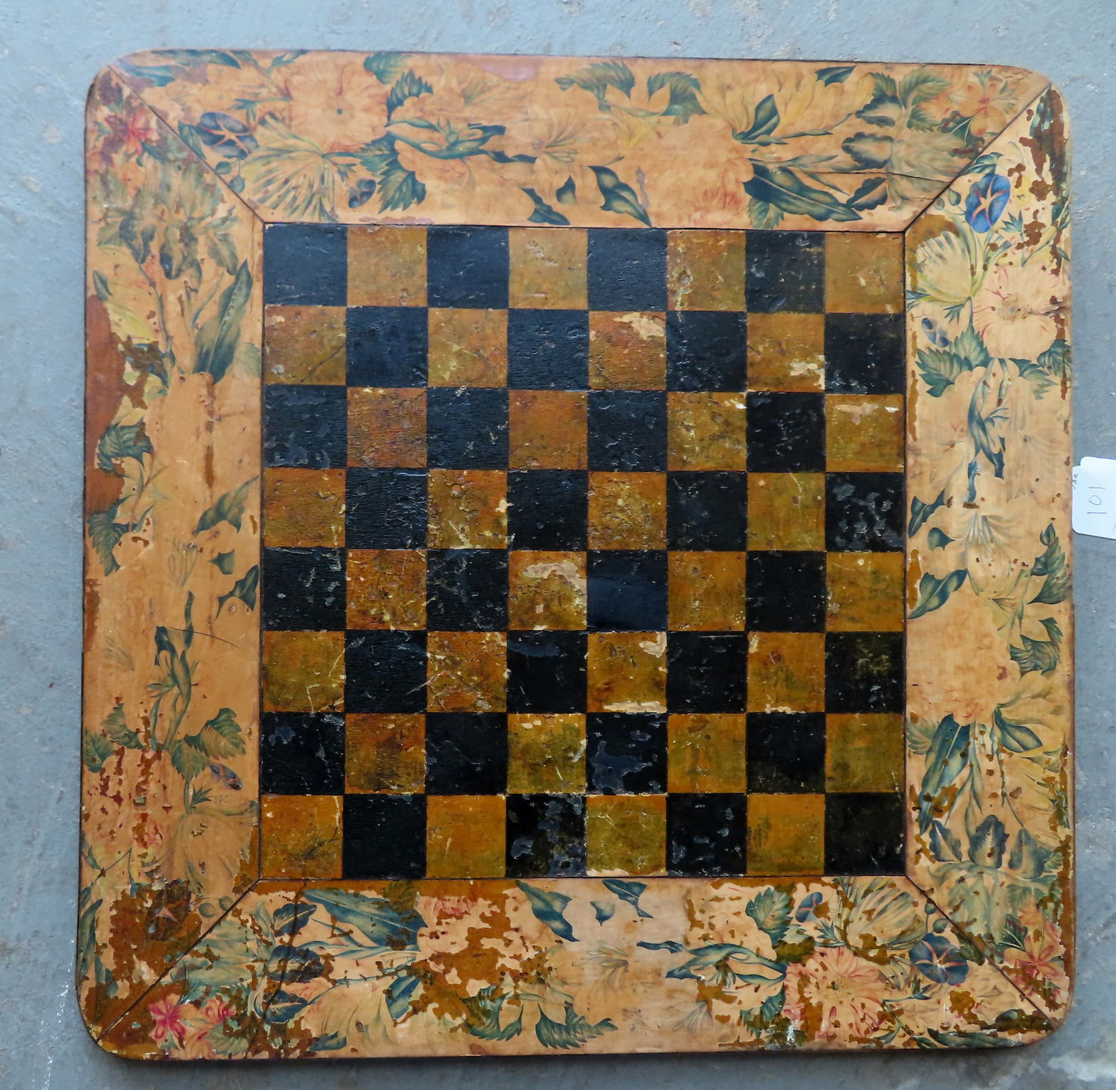An unusual game board with black and mustard colored squares and having a hand painted board (1 of 8)