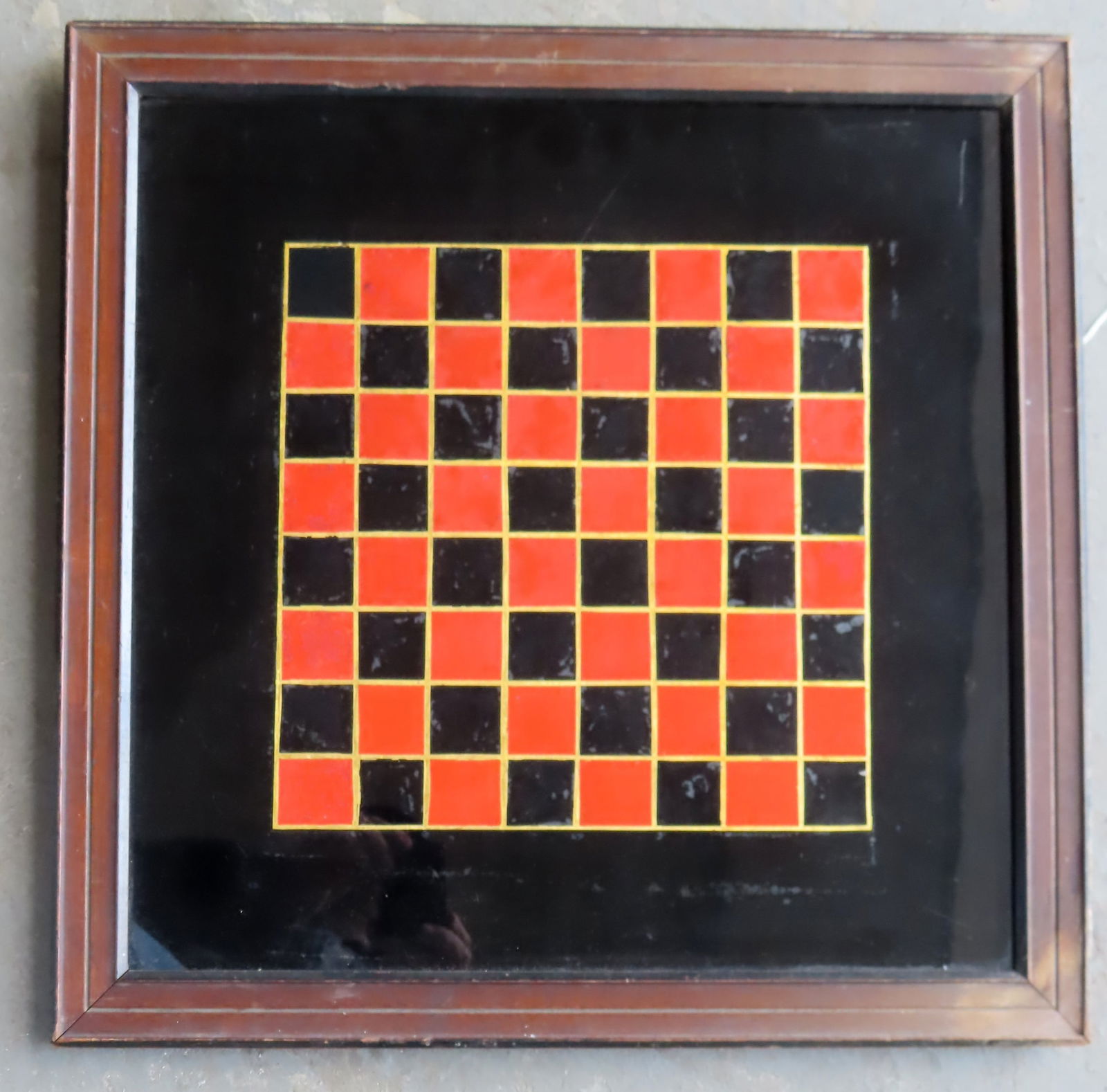 A reverse painted on glass game board in original red and black paint with wooden frame and with (1 of 3)