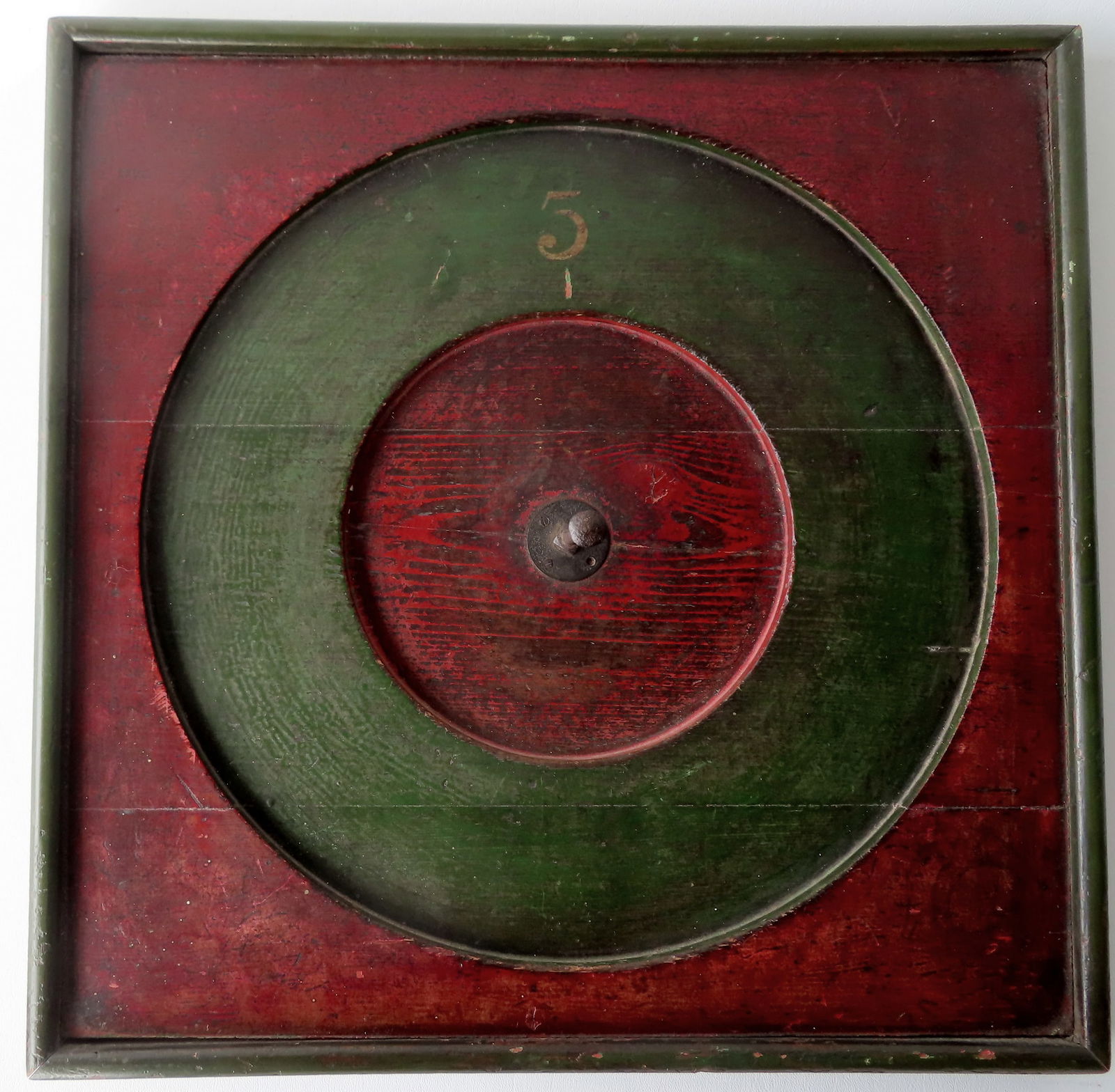 An unusual gaming board, probably ring toss, in original red and green paint with hand forged iron (1 of 4)