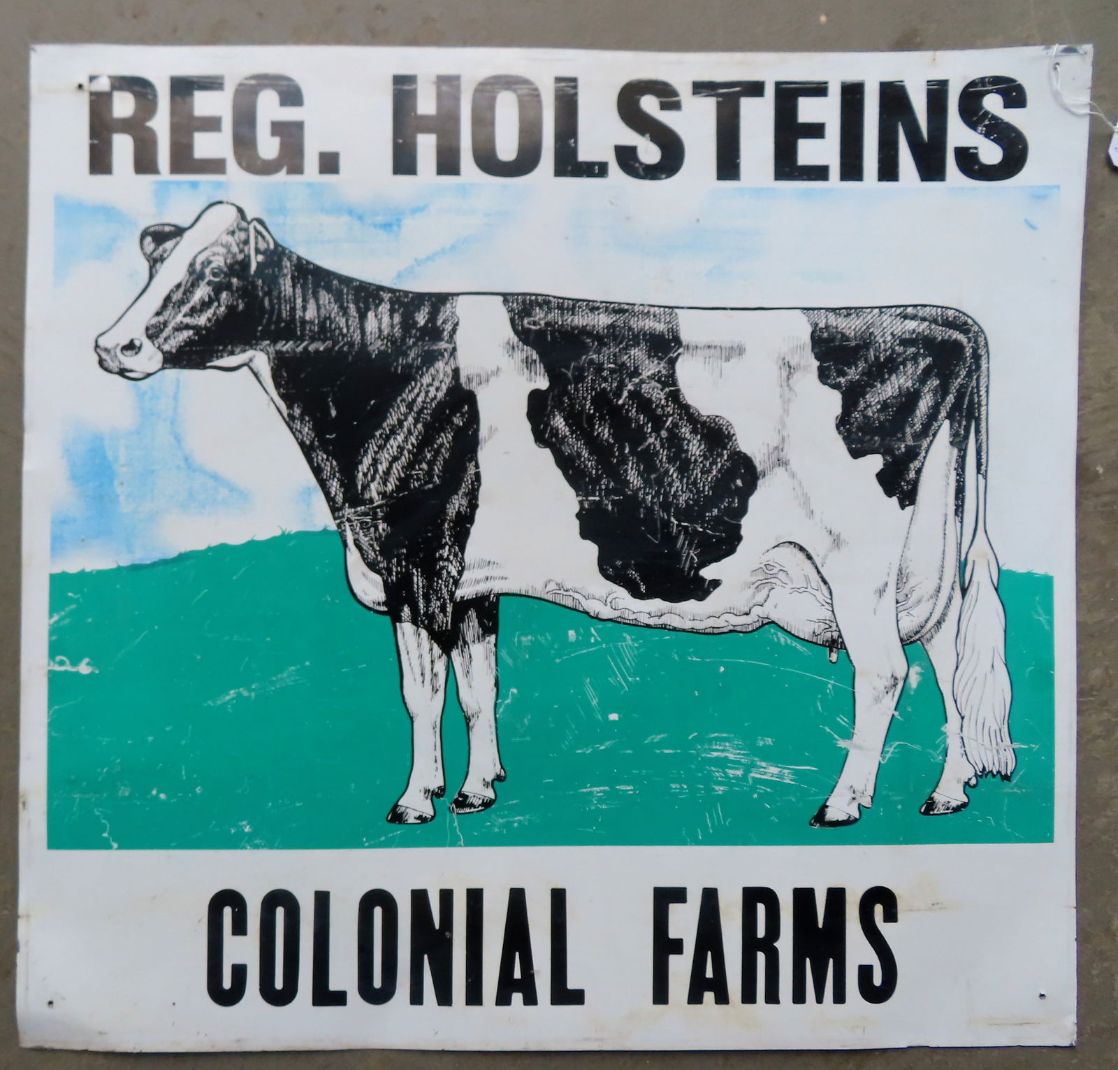 A lithographed aluminum farm sign depicting a large milking cow and marked "REG. HOLSTEINS / (1 of 3)