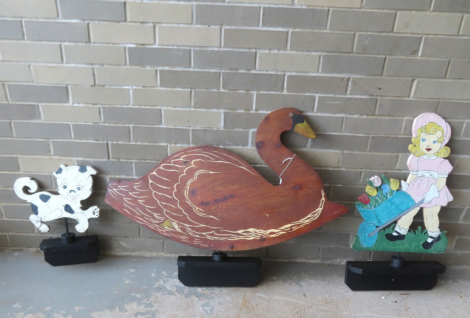 Three hand made and hand painted wooden lawn/garden decorations including young girl with flowers, a (1 of 7)