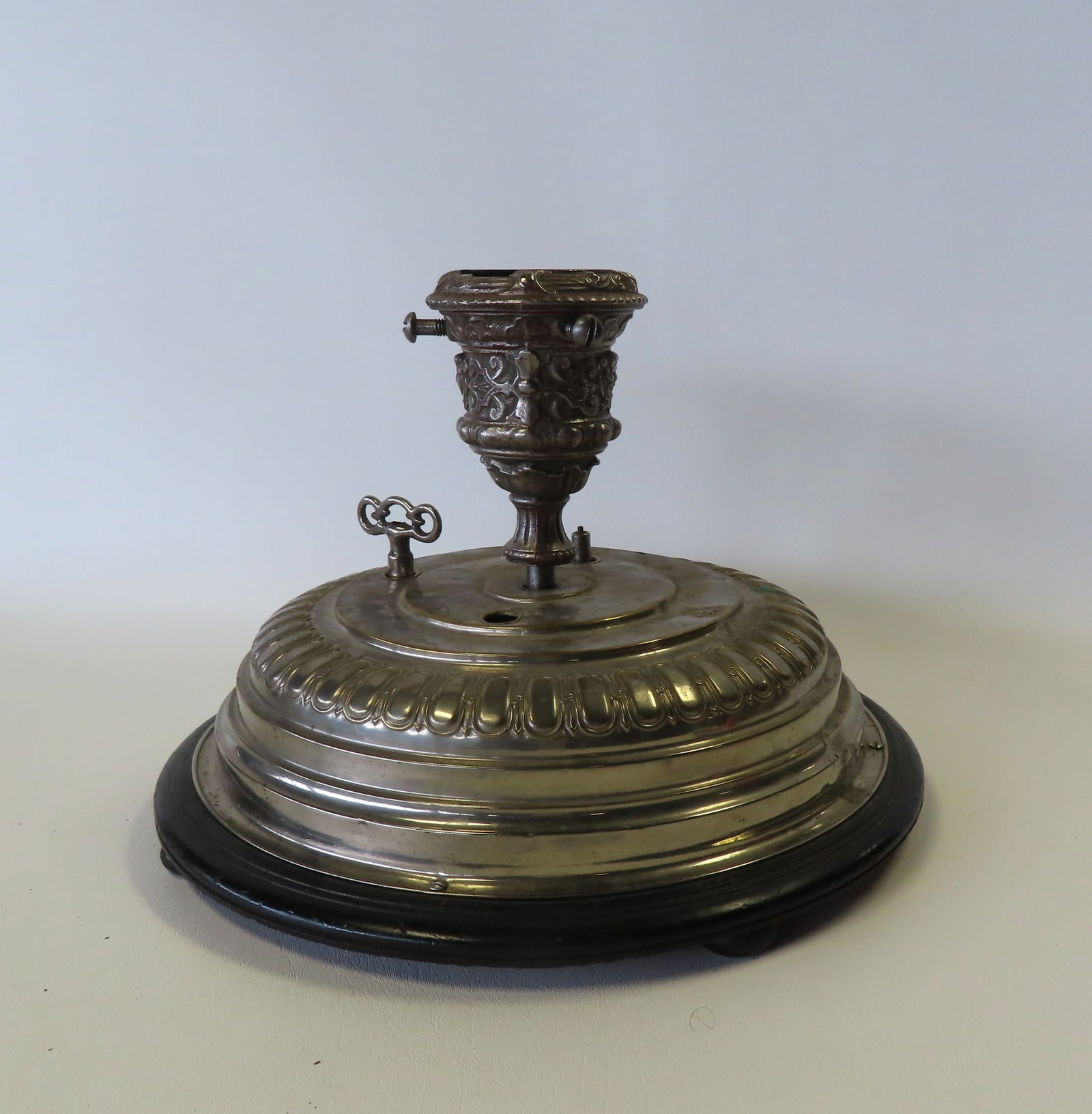 A windup revolving musical German Christmas tree stand with embossed trade mark of Santa holding (1 of 9)