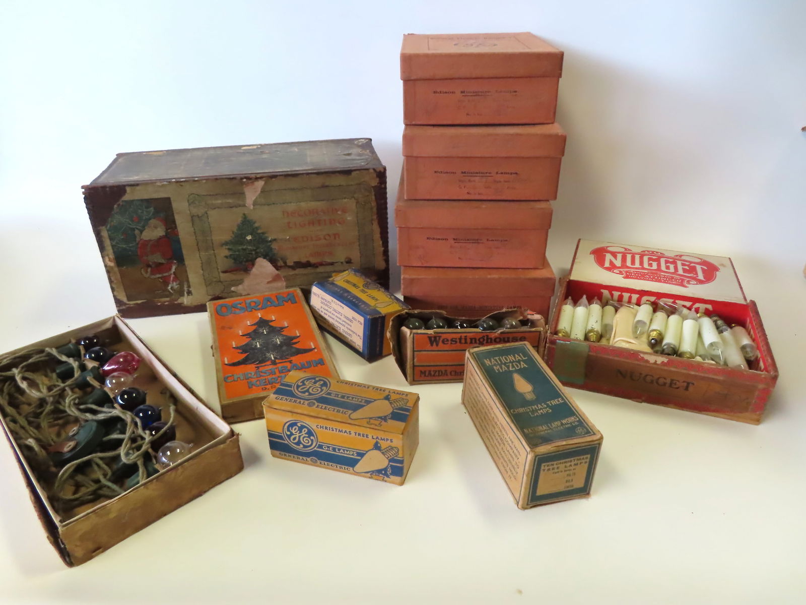 A grouping of vintage Christmas light bulbs, most never used, together with an original lithographed (1 of 15)