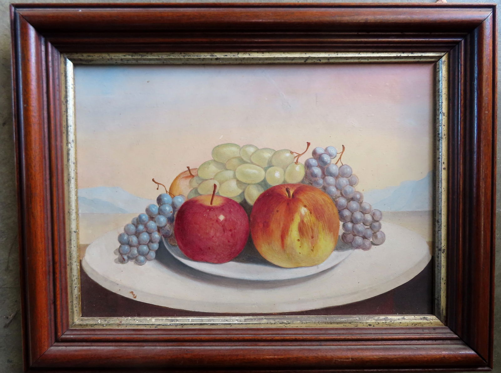 O/B Still life of apples and grapes on table, late 19th century, and appears to be housed in (1 of 3)
