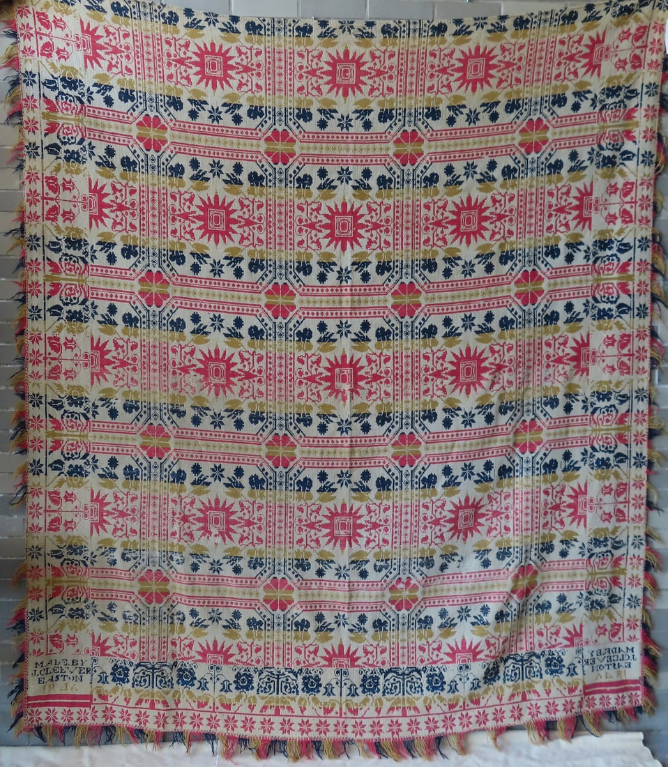 A Pennsylvania tri-colored red, green and blue one piece coverlet decorated with repeating patterns (1 of 7)