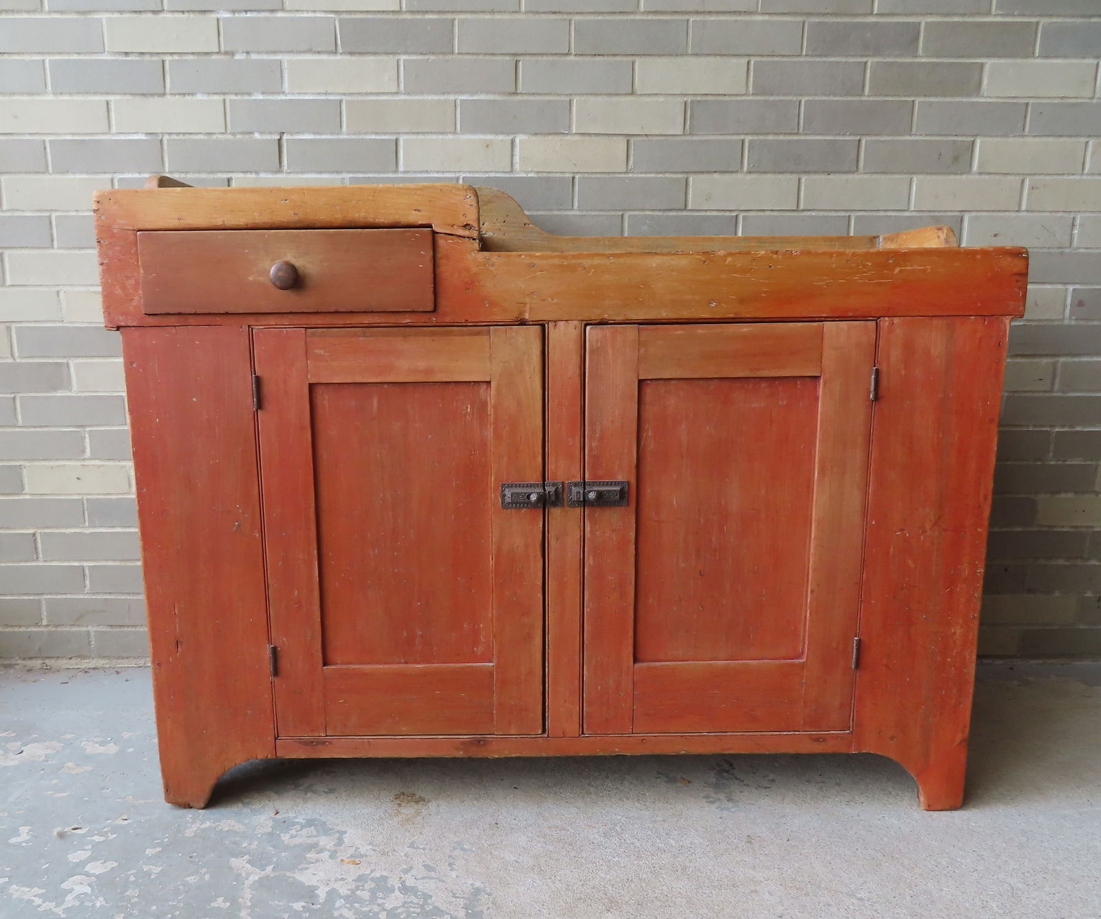 A primitive dry sink having 1 dovetailed drawer over 2 doors, in original red stain, circa 1830-50. (1 of 12)