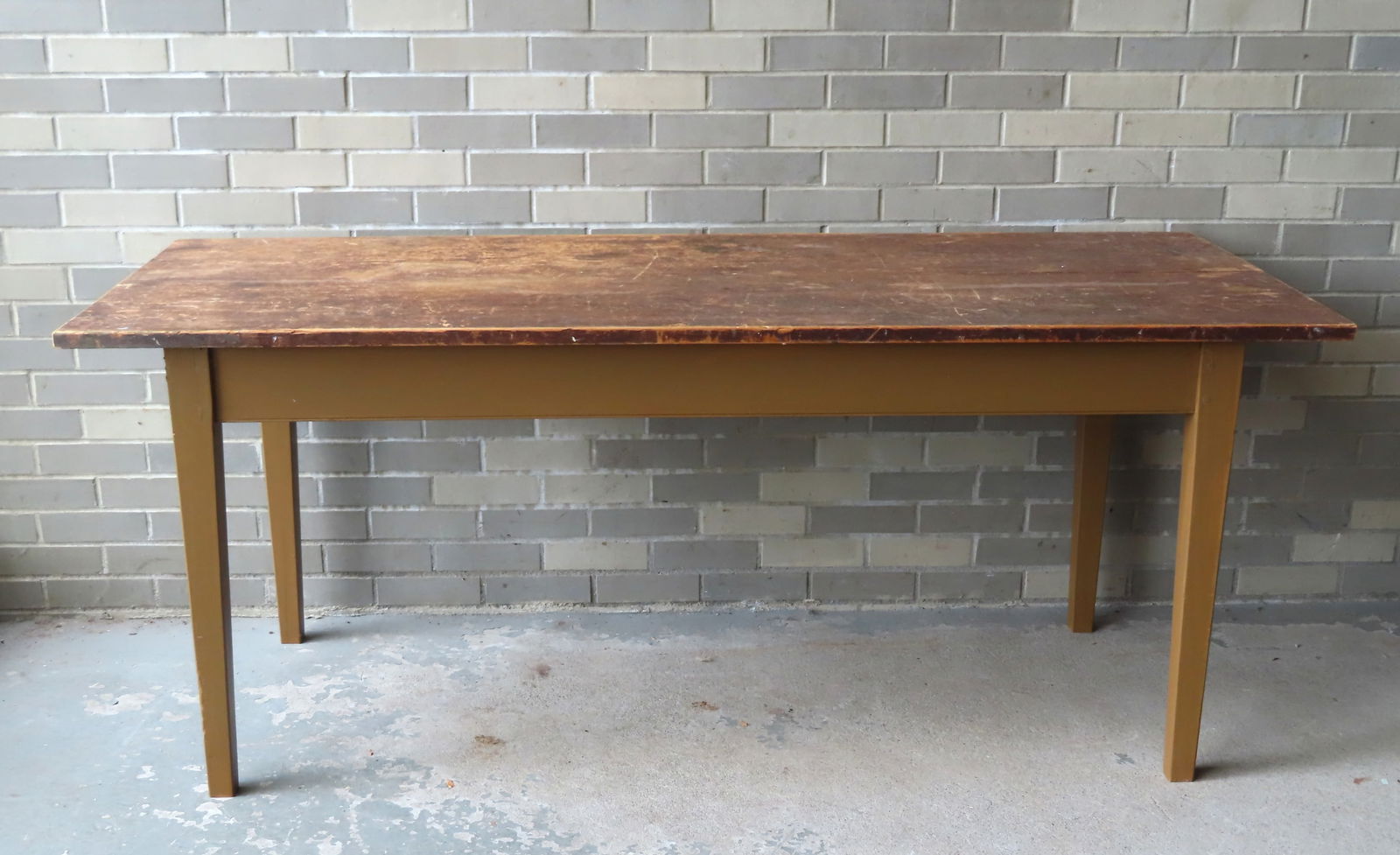 A tapered leg farm table, early to mid 19th century. As you can see in the photos of the underside (1 of 11)