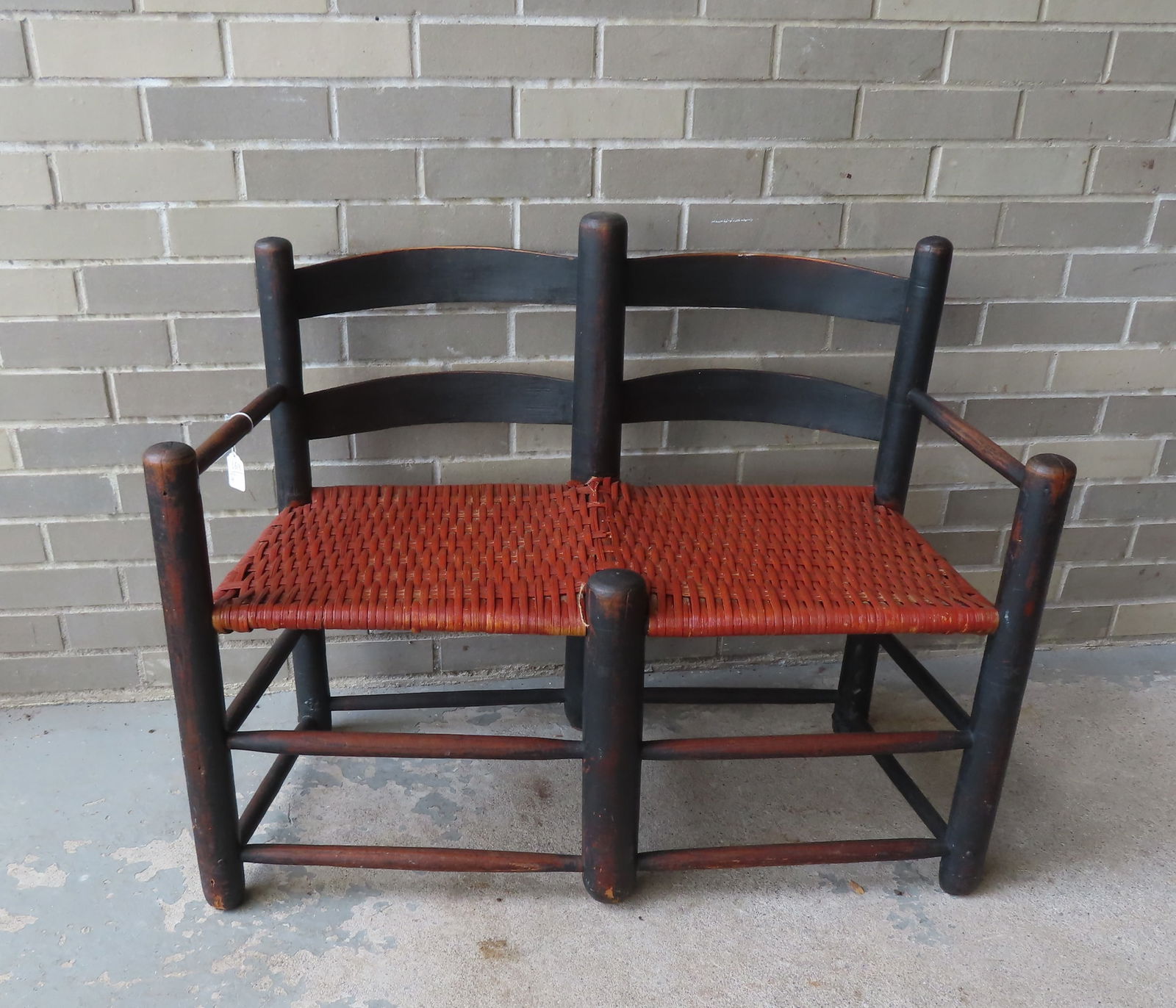 An early ladder back buggy bench in old black paint that appears to be original - newer woven split (1 of 5)