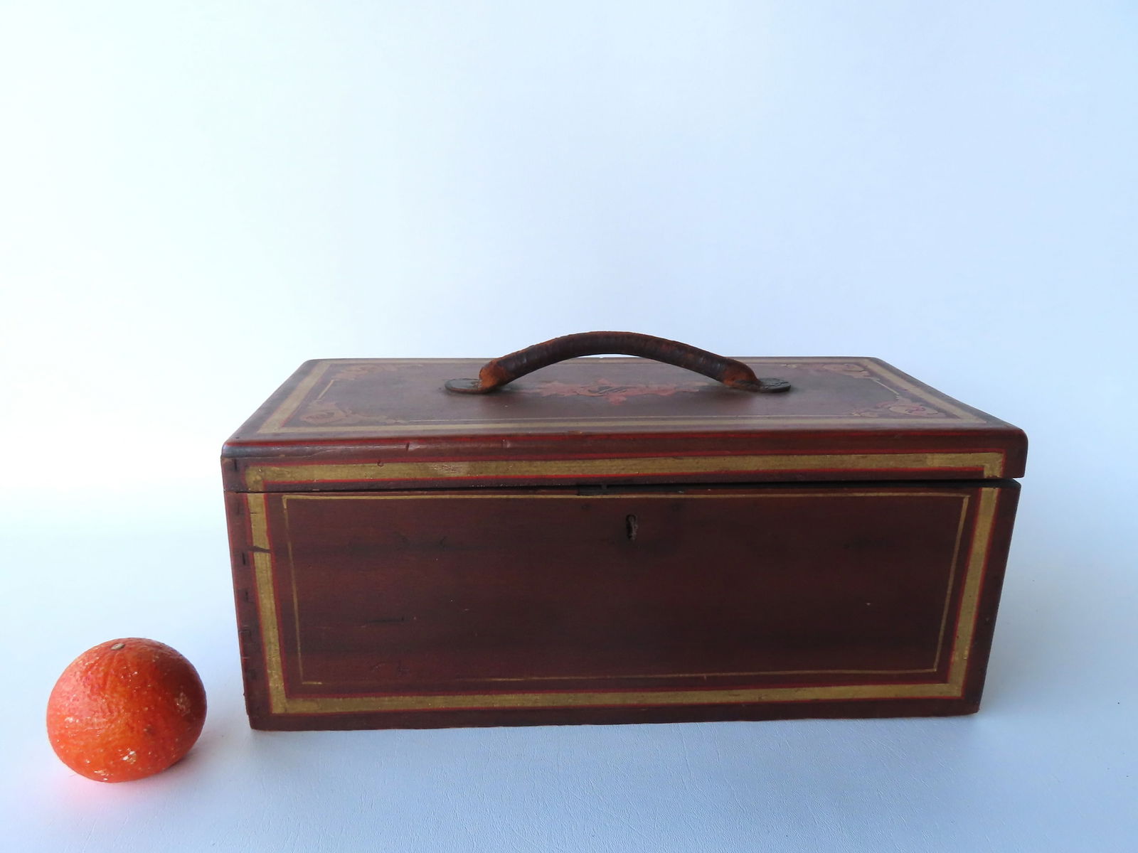 A hand painted document box with yellow and red pin striping and yellow and red scrolls in the (1 of 10)