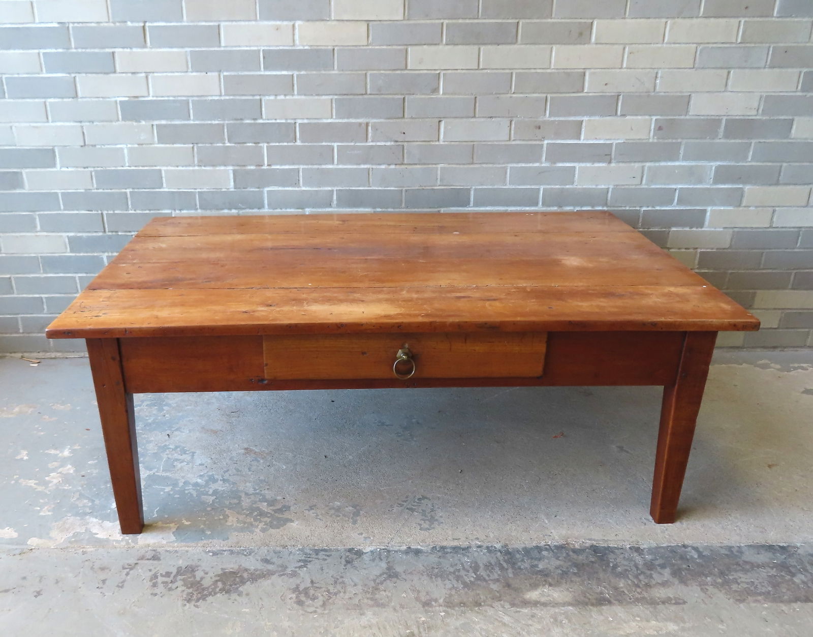 A refinished country farm table, cut down to form a large coffee table, having a single dovetailed (1 of 6)