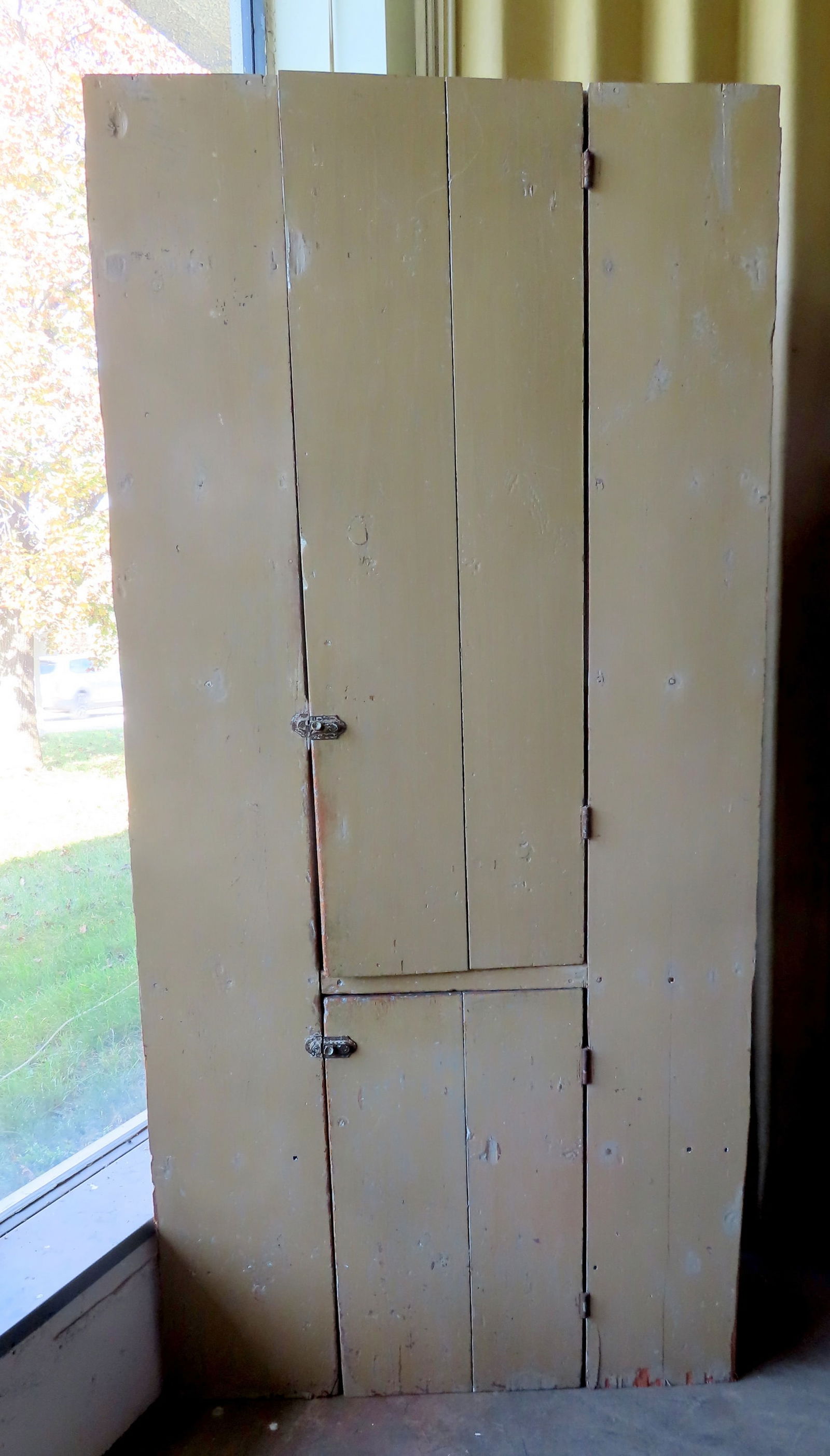 A one piece 2 door primitive corner cupboard with layers of old paint, 19th c. (1 of 9)