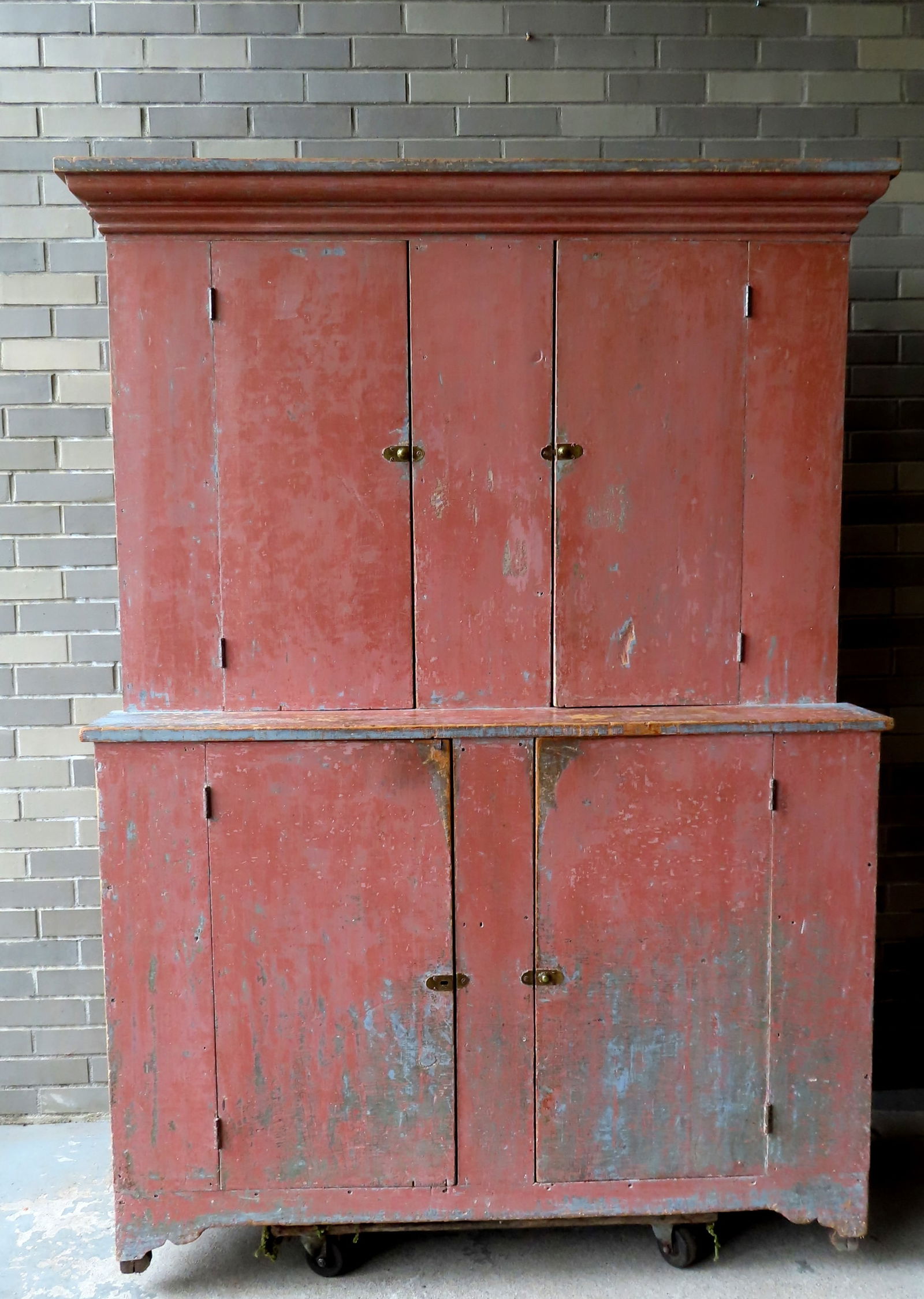 A good primitive step back cupboard having 2 doors over 2 doors on cutout base - scraped down to (1 of 15)