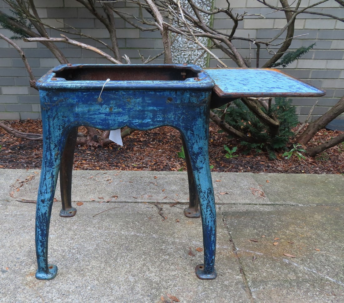 An unusual industrial heavy cast iron machinery base, scraped down to original blue paint, 19th: An unusual industrial heavy cast iron machinery base, scraped down to original blue paint, 19th century. Measures 26"W x 13"D x 22 1/2"H.