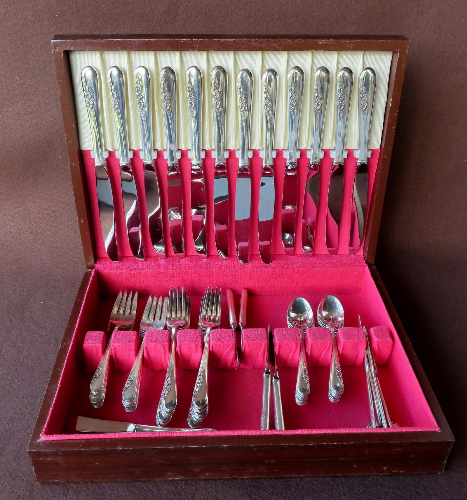 A set of International Sterling flatware in the "Blossom Time" pattern, consisting of 12 knives, 12 (1 of 6)