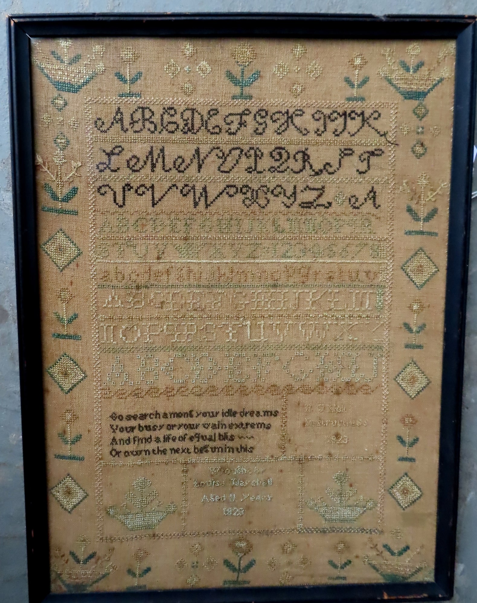 An alphabet and motto sample marked "Wrought by Louisa Marshall Aged 11 Years 1823" - light: An alphabet and motto sample marked "Wrought by Louisa Marshall Aged 11 Years 1823" - light staining, else good condition. Total frame size 17 1/2" x 23 3/4".