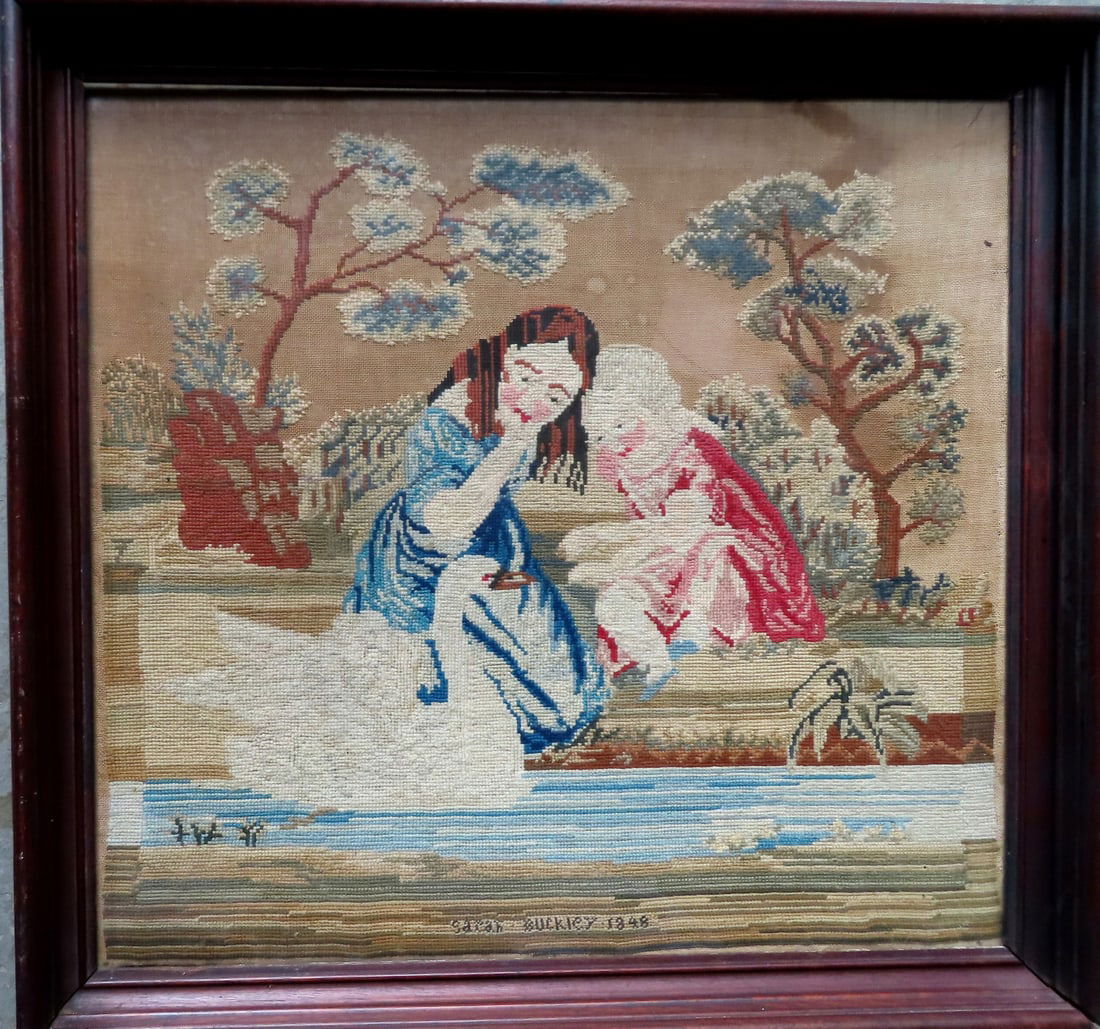 A framed pictorial school girl embroidered sampler depicting 2 children feeding a goose in stream, (1 of 9)