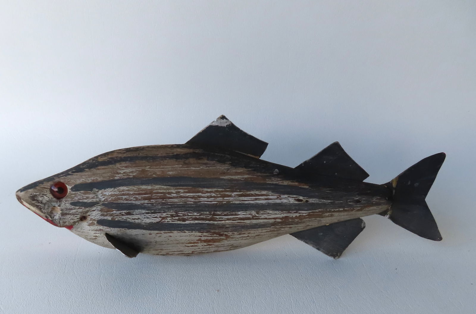 A carved wooden fish decoy with tin fins in original paint, mid 20th century. Measures 11 1/2"L x 3 (1 of 7)