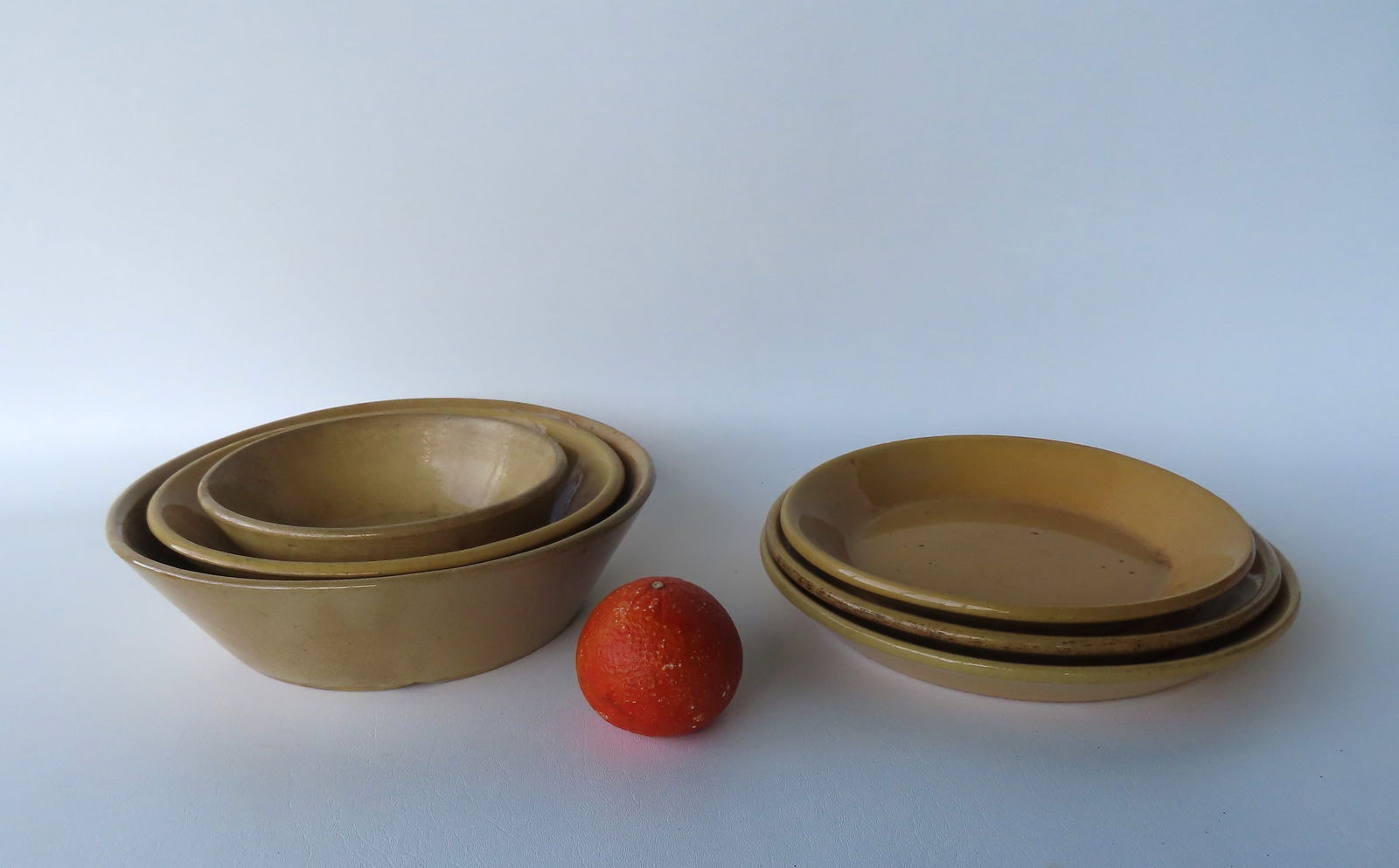 Grouping of 6 yellowware collectibles, 19th century, including 3 pie plates - the largest 11 1/4" (1 of 6)