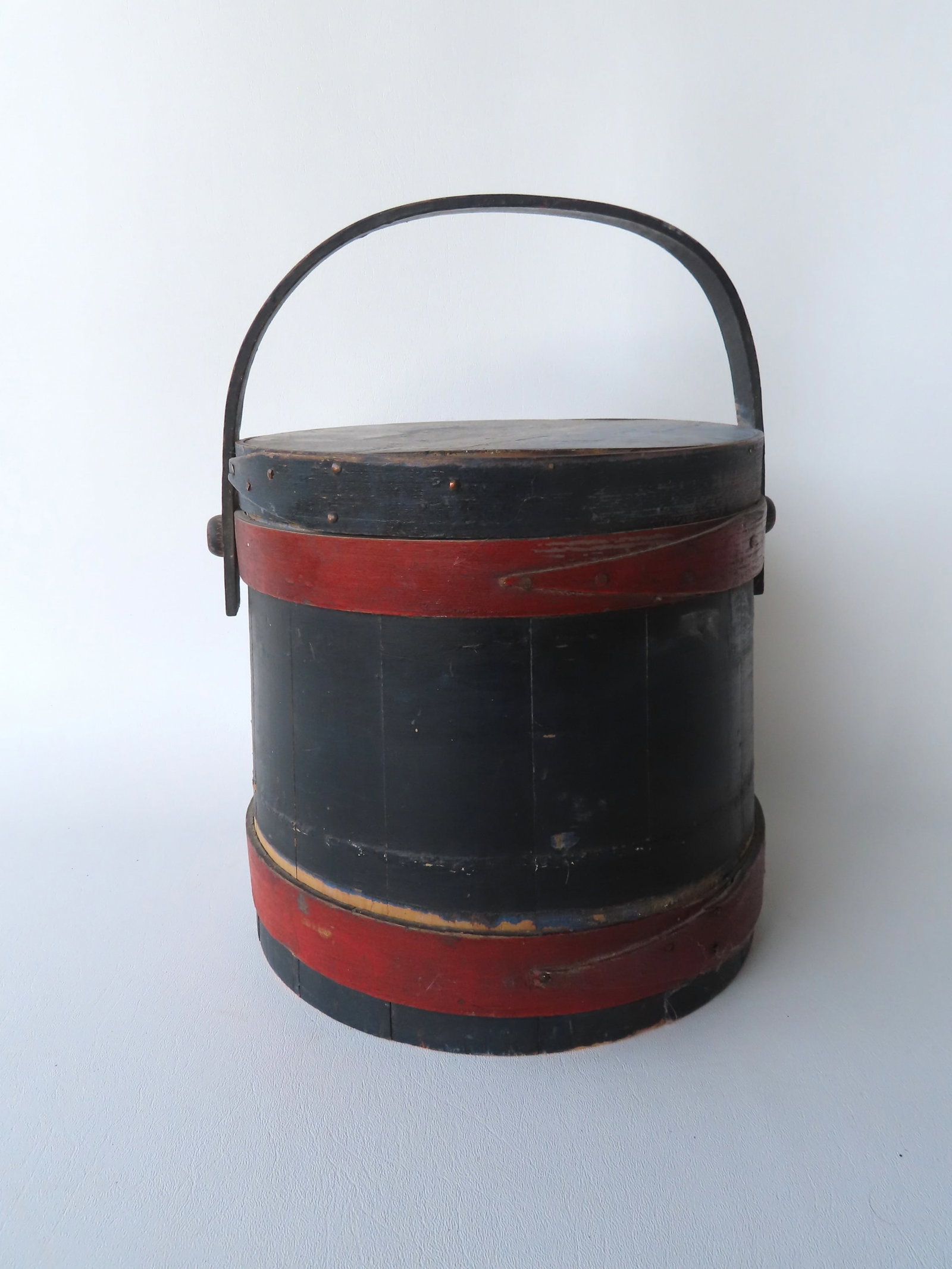 A painted firkin in original dark blue and red paint, late 19th century. Measures 10"W x 13 1/2"H (1 of 8)