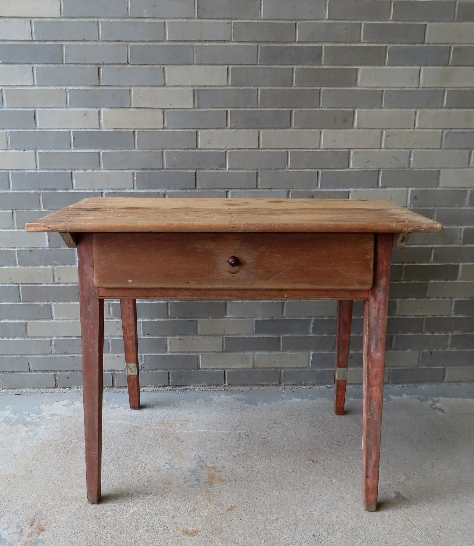 An early tap table with single drawer and tapered and splayed legs, traces of original salmon stain, (1 of 8)