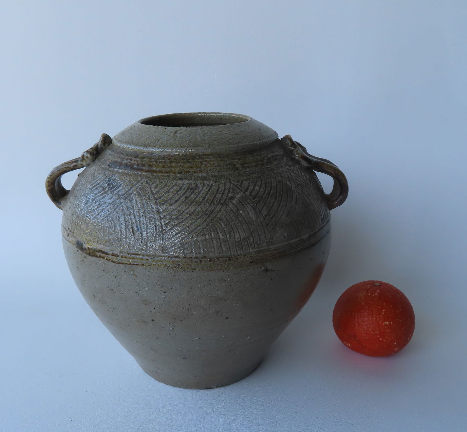 A Jugtown stoneware ovoid jar with applied and shaped double handles with brown glaze and having a (1 of 5)