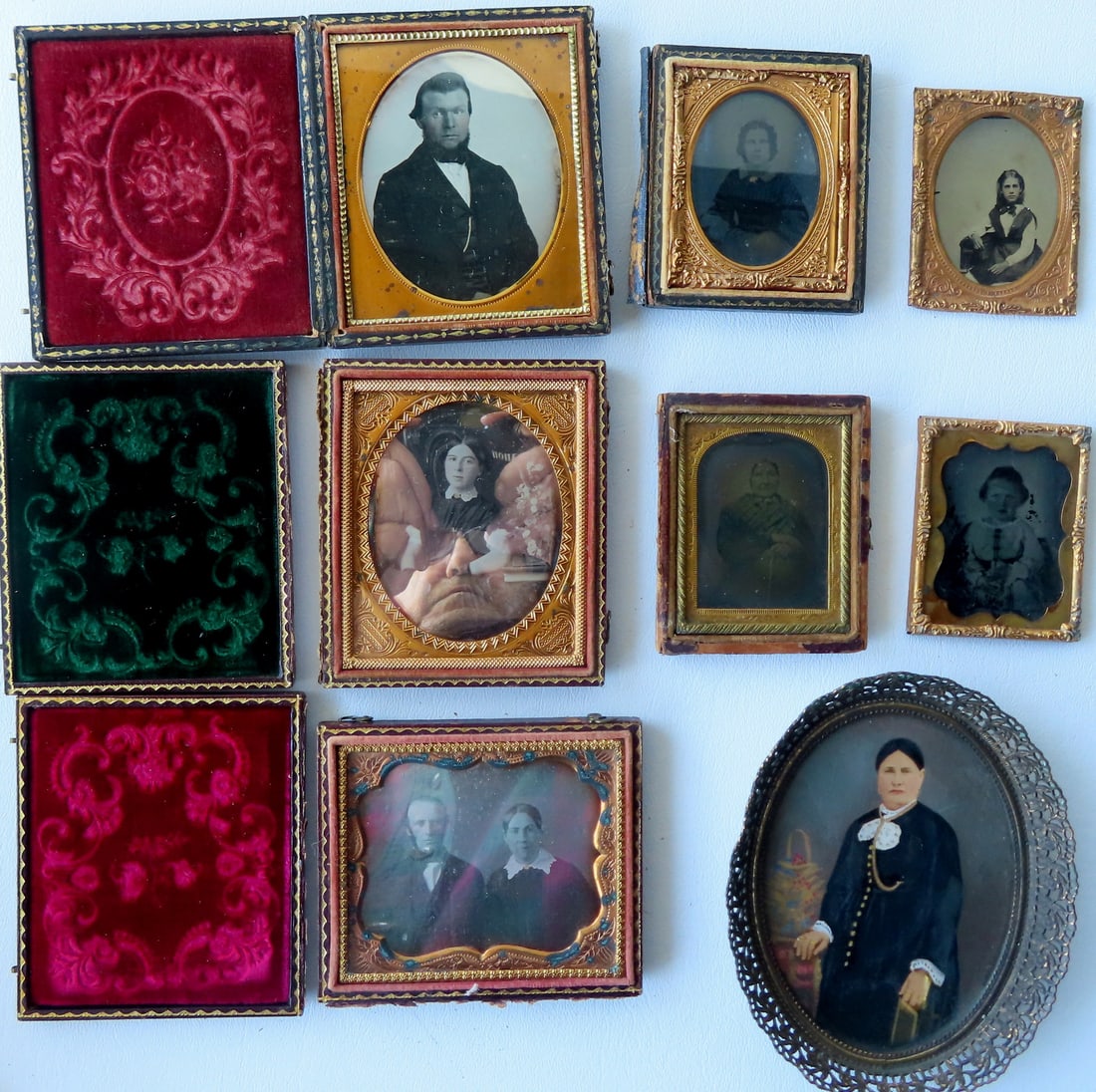 Grouping of cased photos and miniature watercolor of lady. Includes 3 Daguerreotypes, the largest (1 of 9)