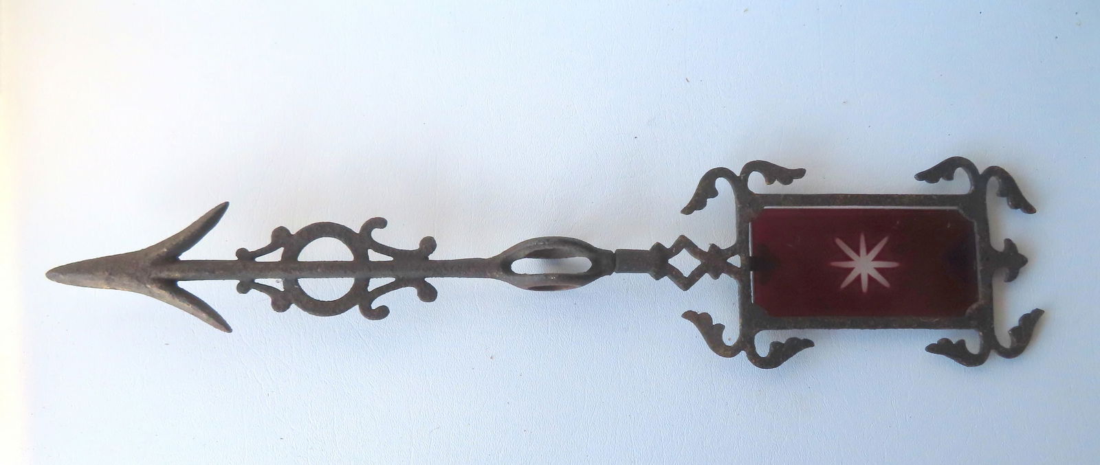 A cast iron lightening rod arrow with ruby cut-to-clear glass insert in feather with star (1 of 4)