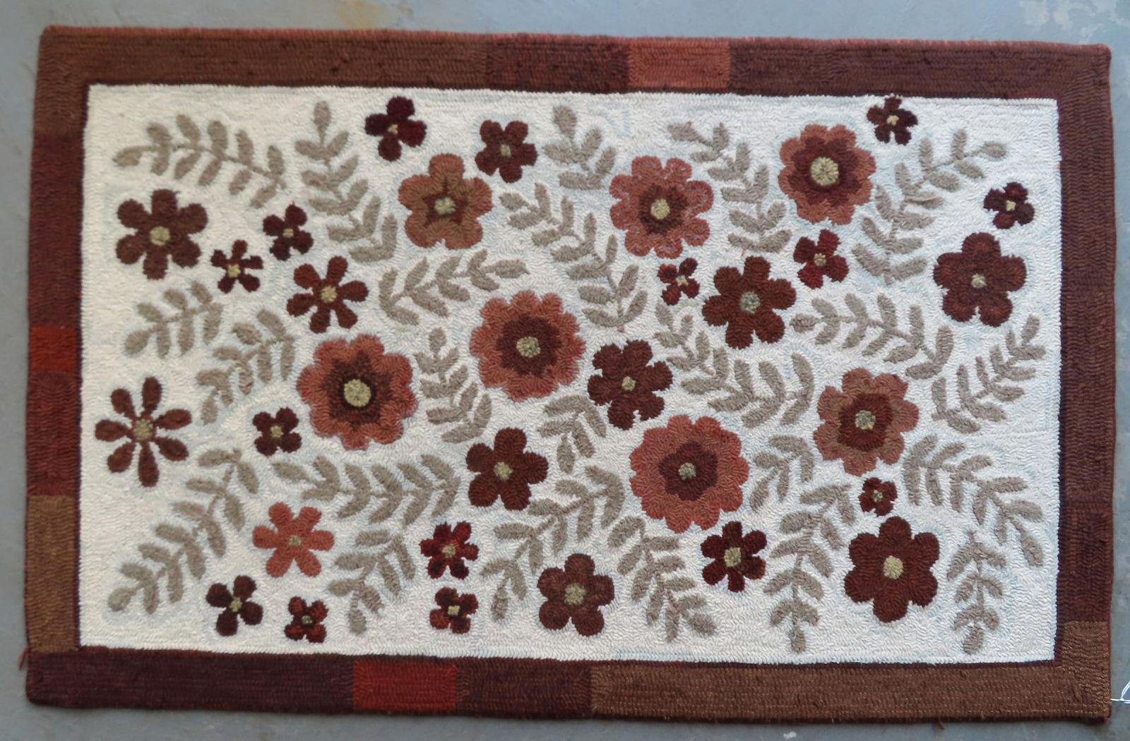 Floral hooked rug, all wool in very good unused condition, circa 1980-2010. Measures 58" x 36 1/2". (1 of 5)