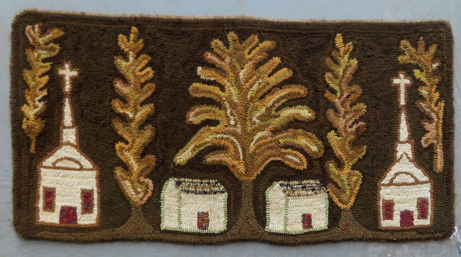 A folk art design hooked rug decorated with trees, church and houses, all wool and in very good (1 of 4)