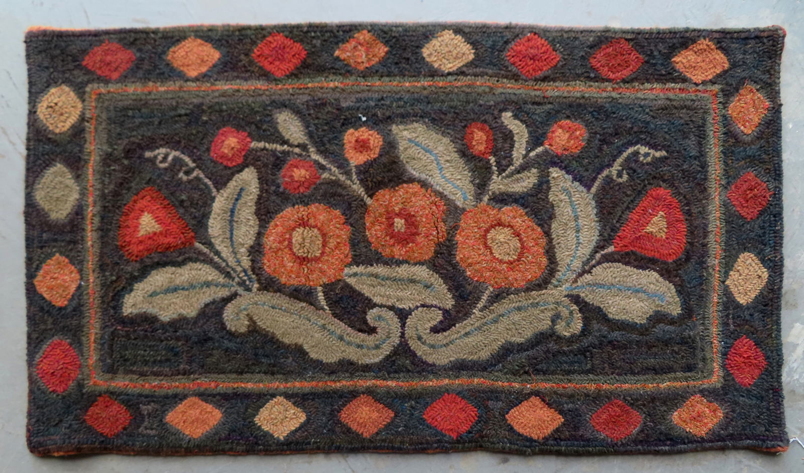 A folk art floral hooked rug with a diamond border, all wool in very good unused condition, circa (1 of 4)