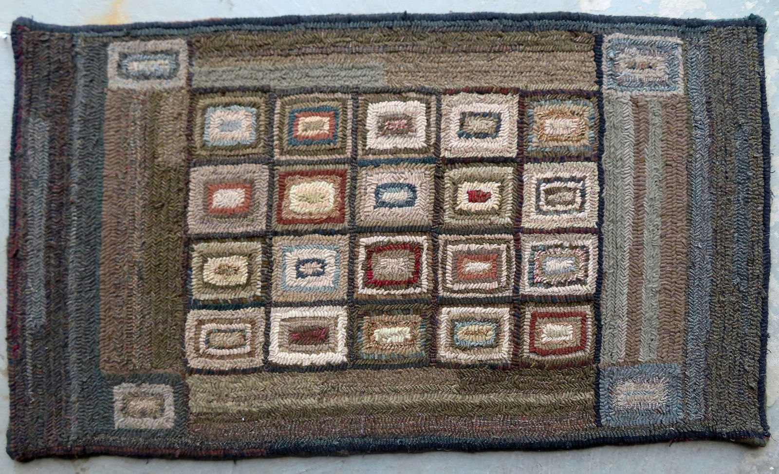 A hooked rug in a geometric design with striated border, all wool in very good unused condition, (1 of 4)