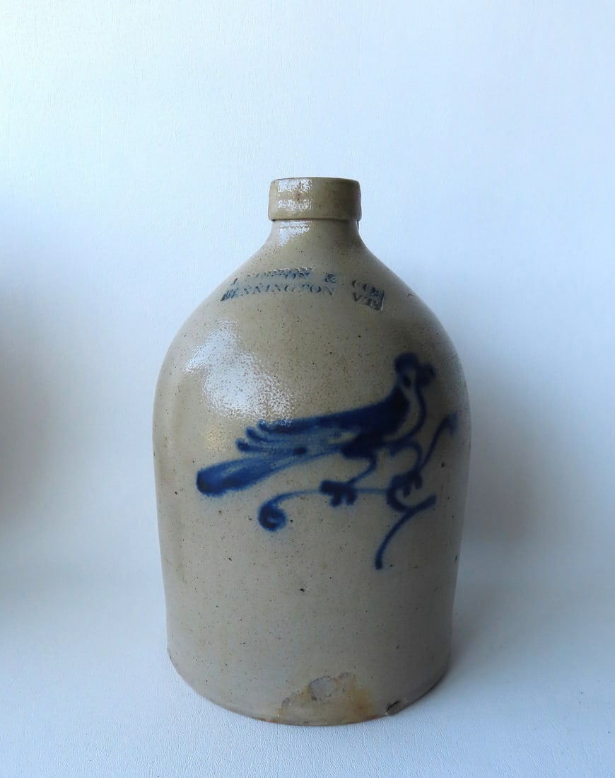 A small stoneware jug, probably 1 gallon, decorated with a cobalt blue bird on branch, with the (1 of 5)