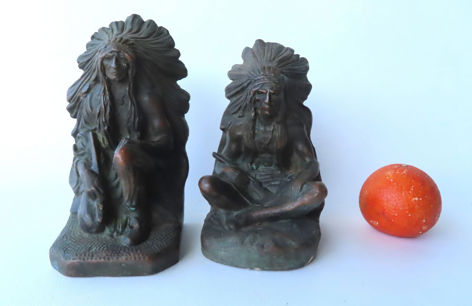 A pair of bronze clad bookends in the form of a Native American Chief, early 20th century. Signed on (1 of 5)