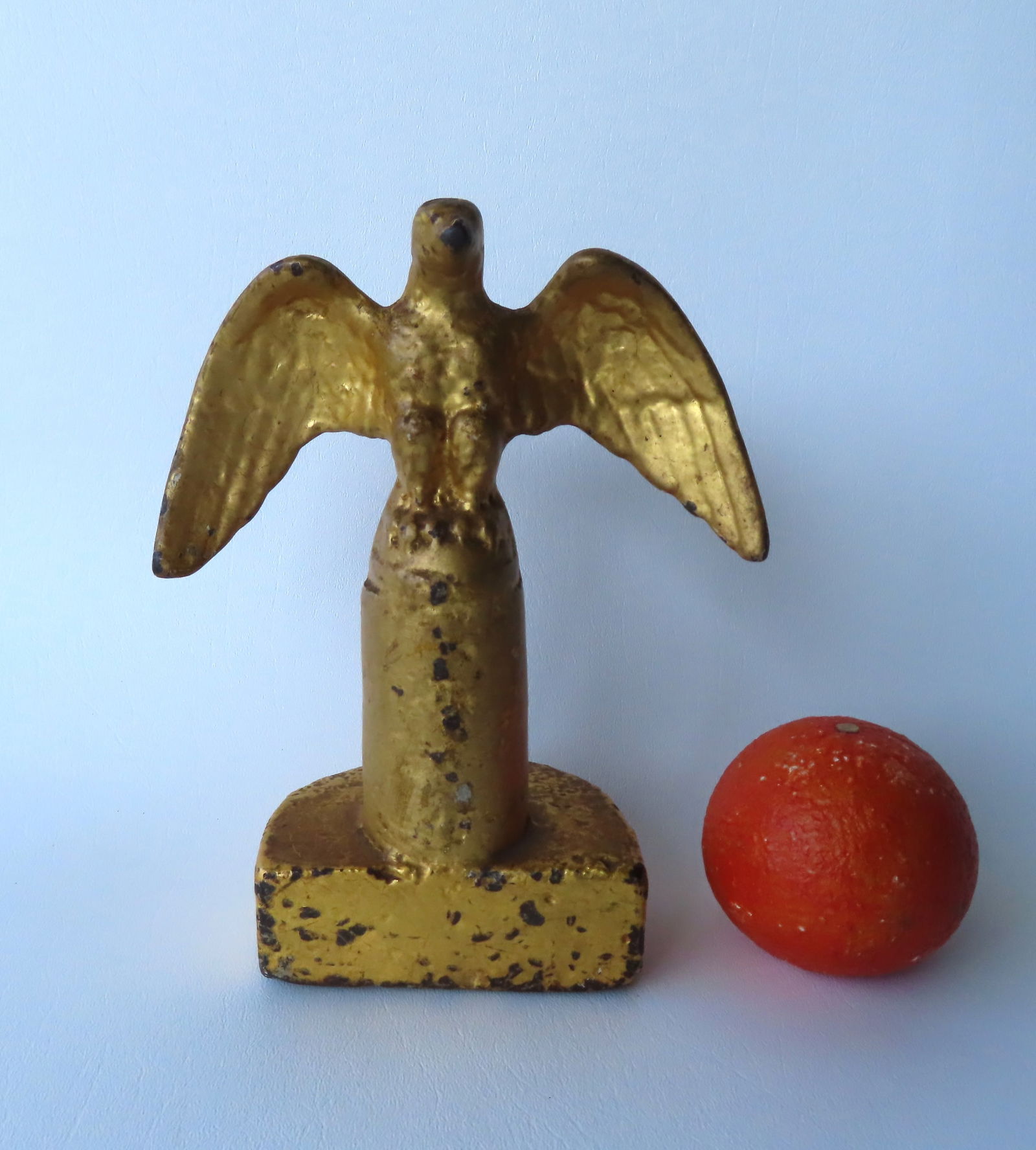 A cast iron spread wing eagle door stop or bookend with original gilded surface, early 19th century, (1 of 4)