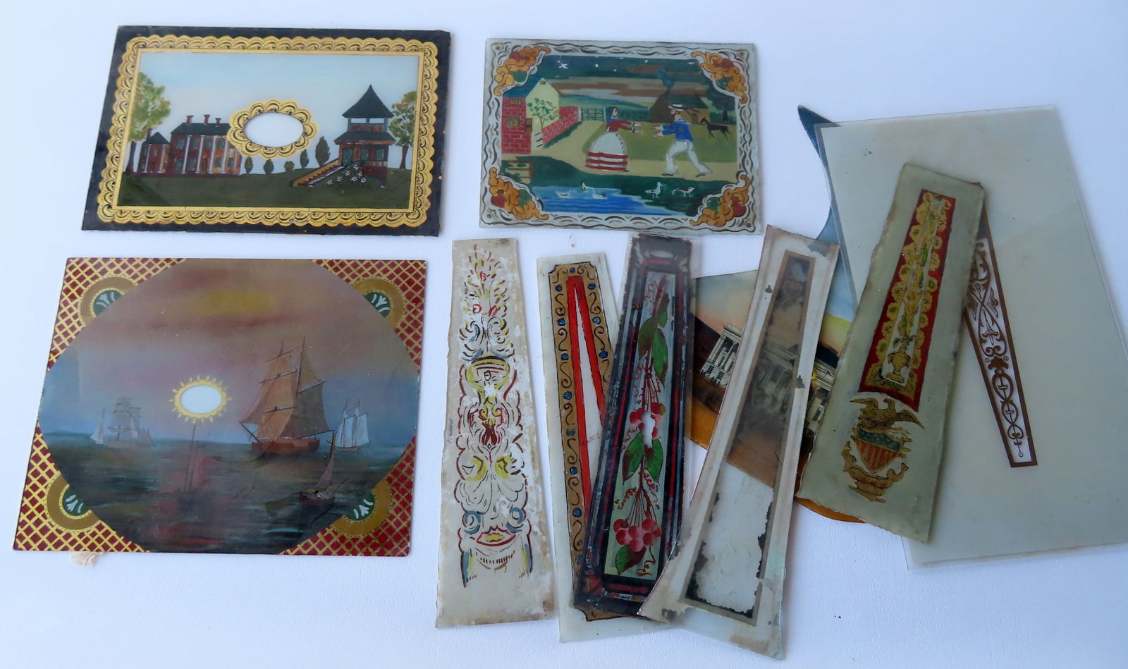 A grouping of reverse painted glass clock panels, including 3 hand painted rectangular panels - the (1 of 7)