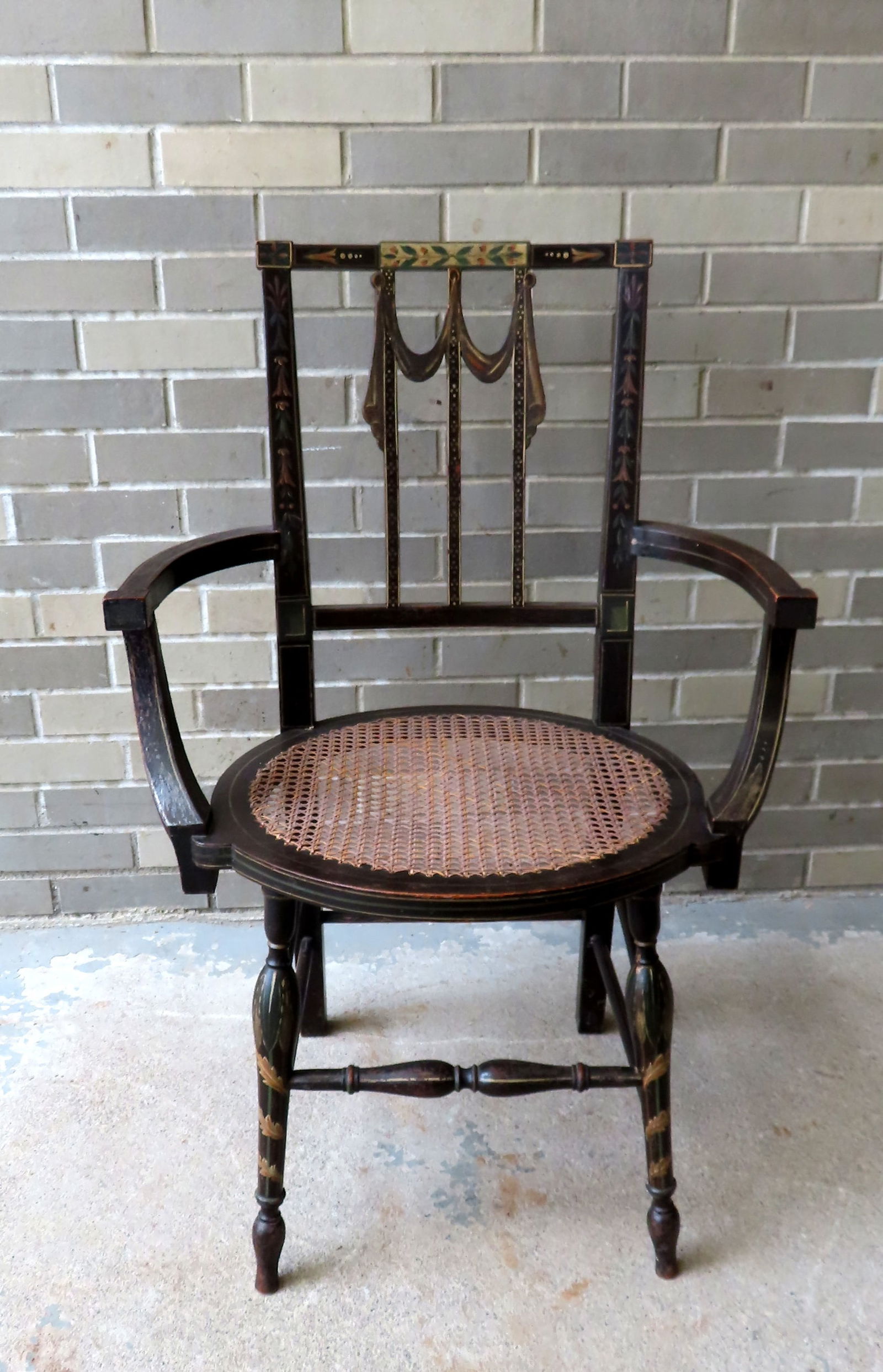An unusual transitional federal side chair with rounded arms, cane seat, turned legs and stretchers (1 of 9)