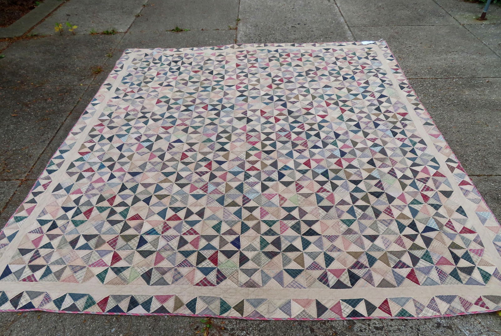 A newer patchwork hand sewn quilt with machine sewn border (label removed), possibly from a local (1 of 7)