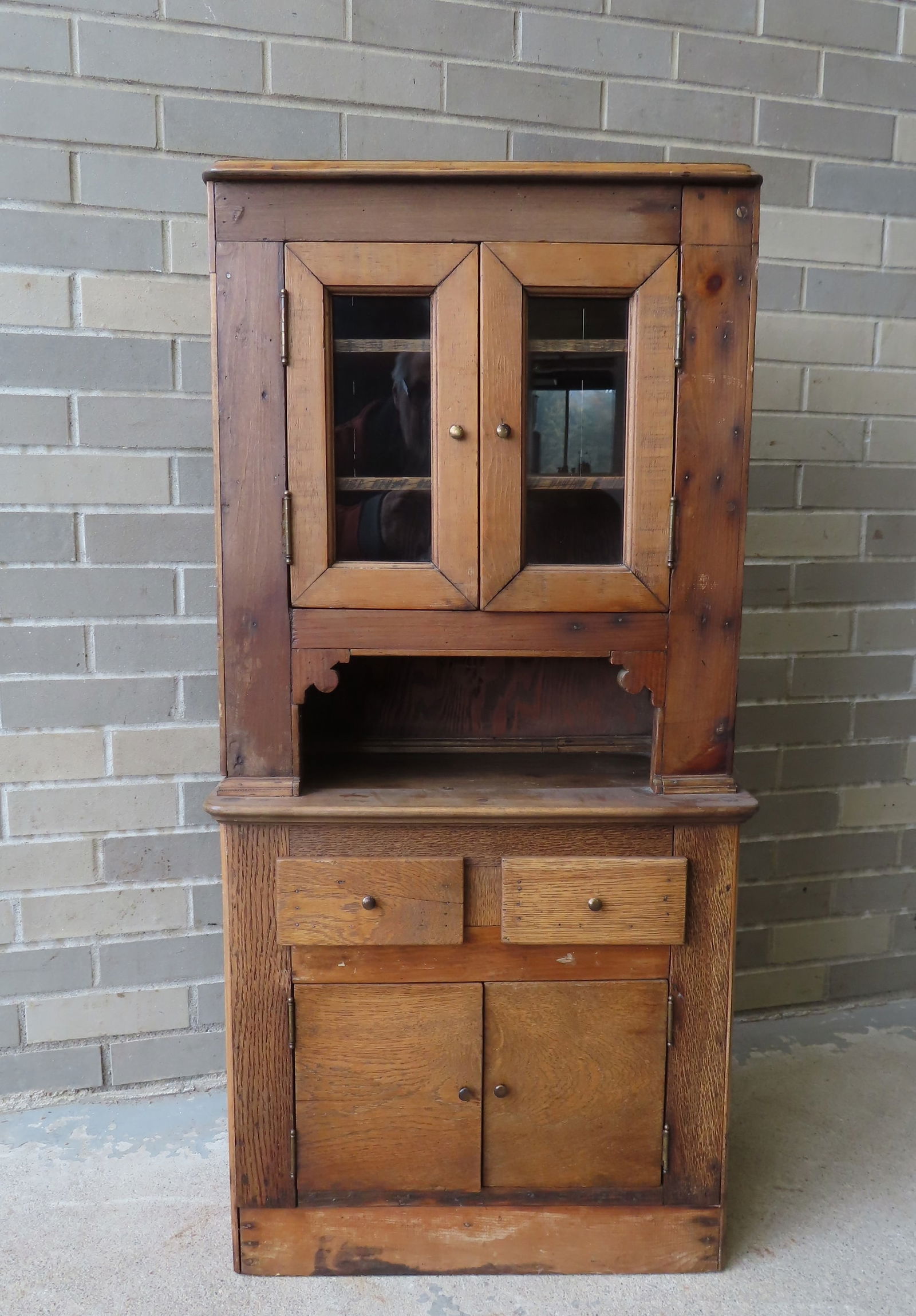 A child's stepback cupboard in pine and oak, having 2 glass doors and an open shelf on the top (1 of 12)