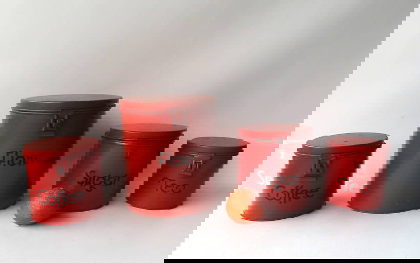 A Nested Set Of 4 Painted Tin Kitchen Storage Cannisters Signed Kreamer.