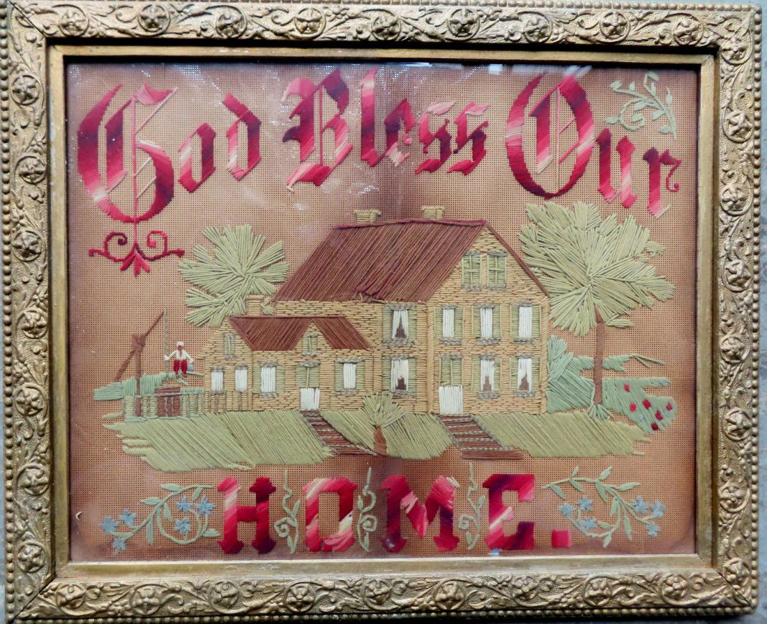 A Victorian embroidered sampler titled "GOD BLESS OUR HOME". (1 of 4)