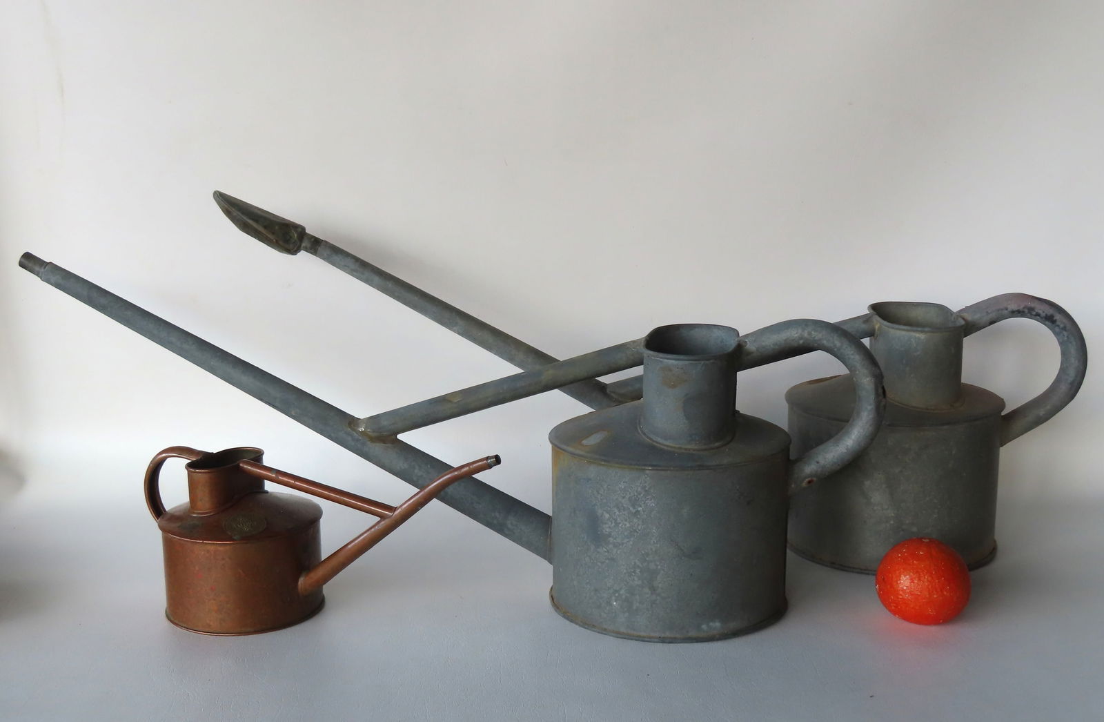 Three vintage English watering cans marked Hawes - England. Two in galvanized metal with long necks (1 of 7)