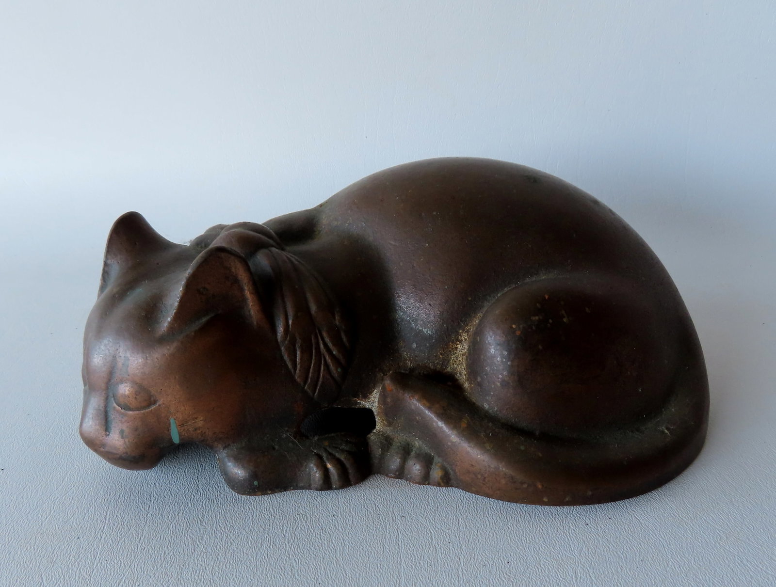 A cast iron resting cat door stop with  brass/bronze finish, attributed to National Foundry (1 of 4)