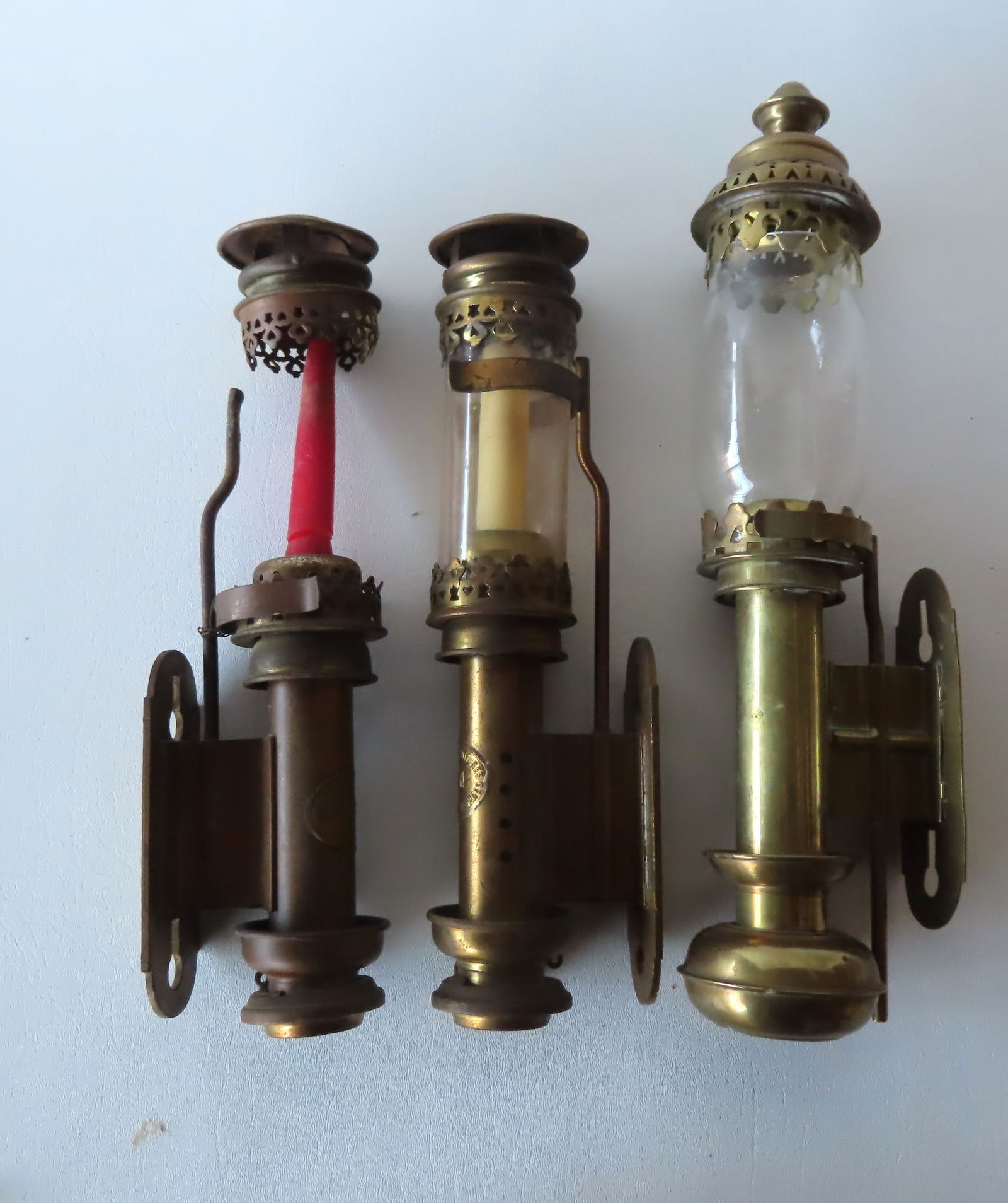 Grouping of 3 brass wall mounted candle lights for carriage or automobile, 2 matching signed "P.L.M (1 of 8)