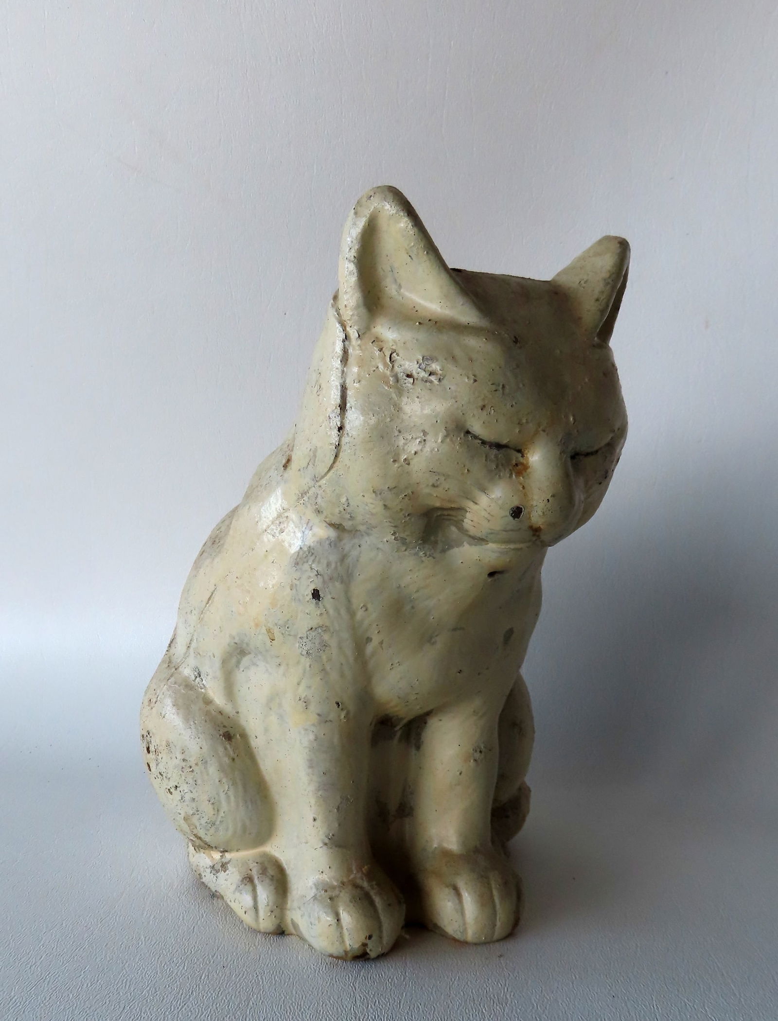 A Hubley cast iron white seated cat door stop with closed eyes, full body, original paint, early (1 of 6)
