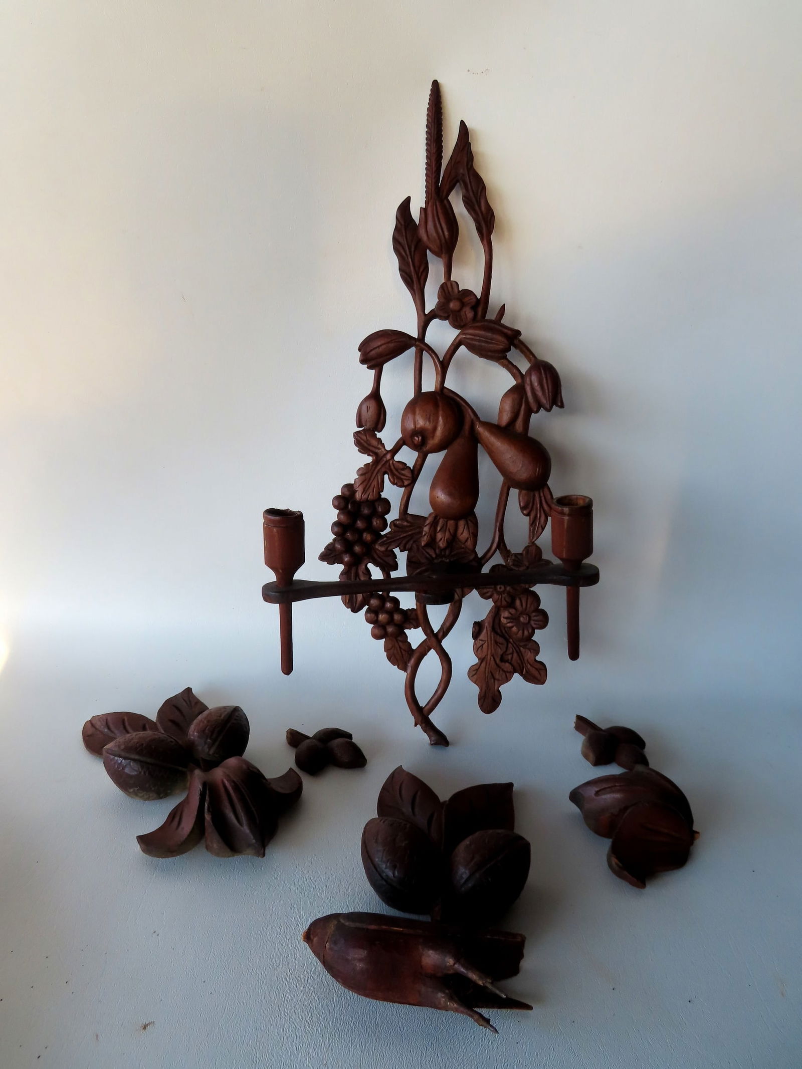 Grouping of vintage carved wooden collectibles including a double candle wall sconce decorated with (1 of 11)