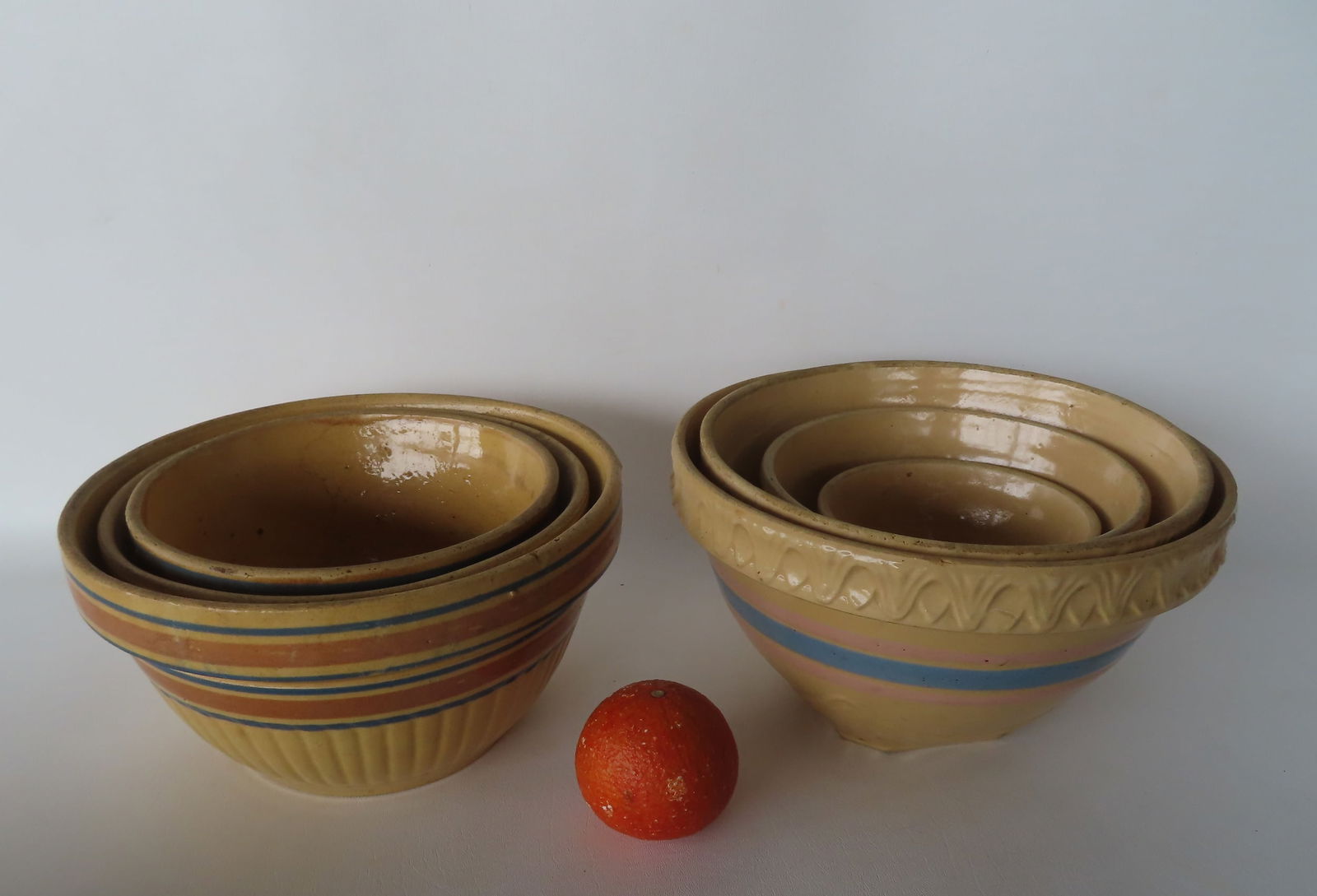 Grouping of 7 yellowware mixing bowls including: A set of 4 nesting bowls with blue and pink bands - (1 of 11)