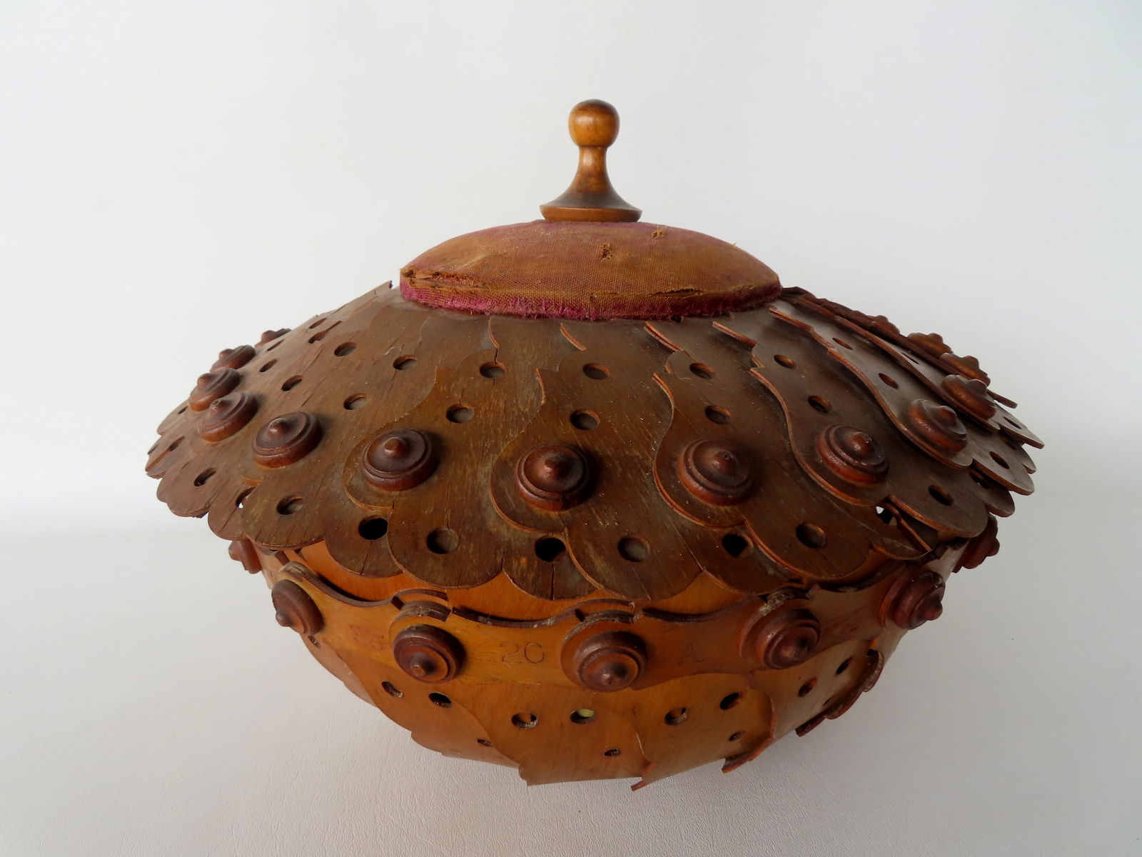 An interesting folk art circular covered sewing basket with thread holders mounted to the sides of (1 of 11)