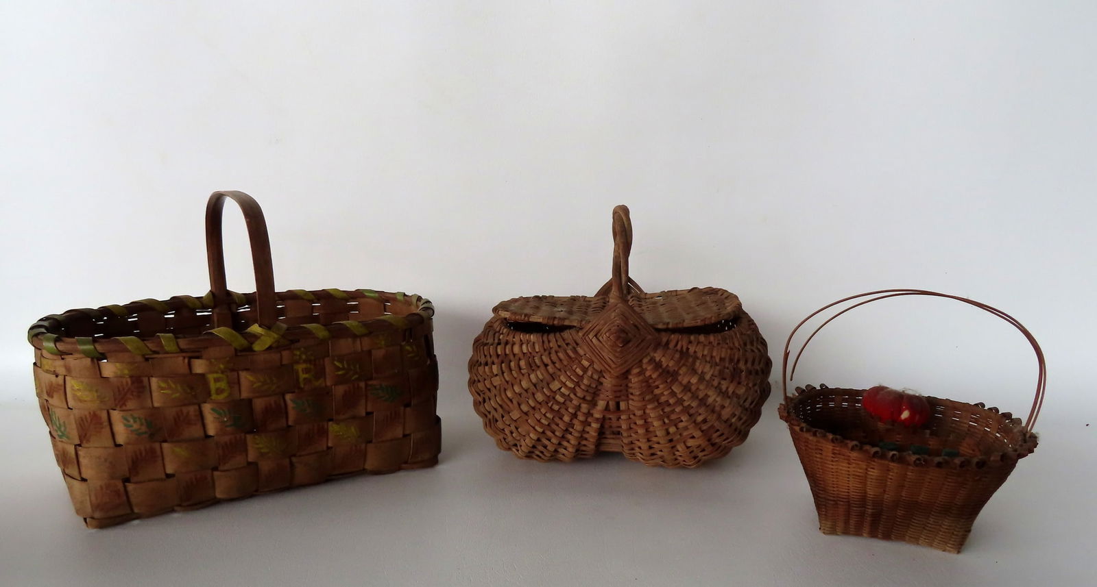 Three early baskets including a very fine Native American basket with single loop handle, and hand (1 of 17)