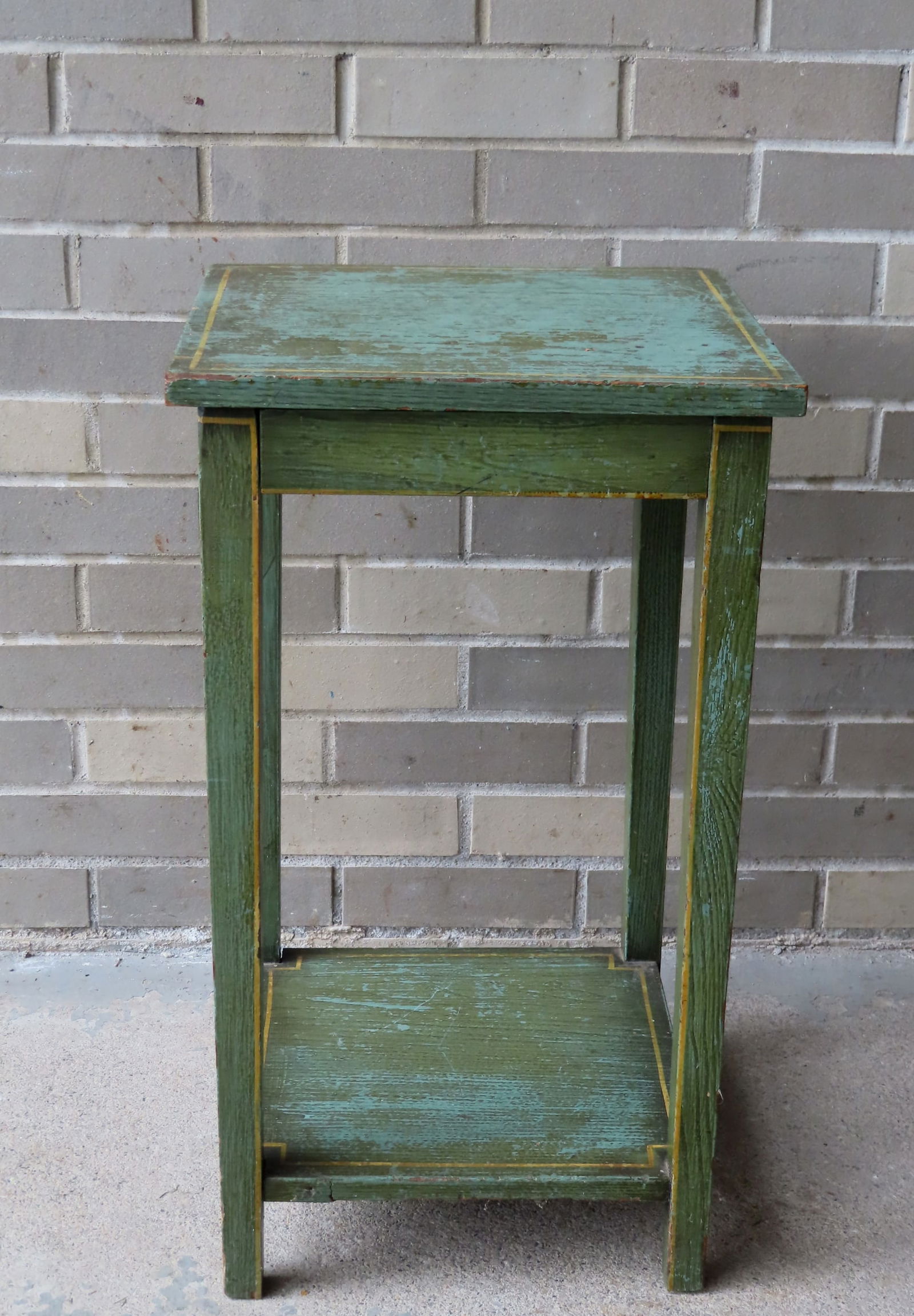 A tapered leg 1 drawer stand with lower shelf and original green paint with yellow pin striping, (1 of 5)