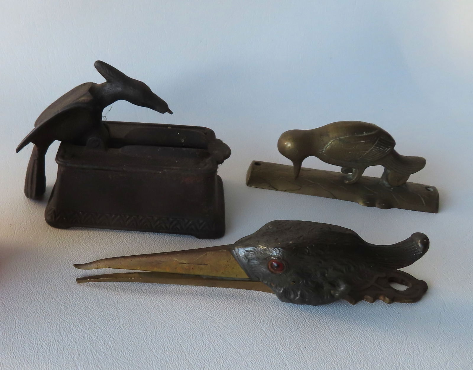 Three mechanical metal figural decorative objects including: A brass woodpecker door knocker - 4 (1 of 7)